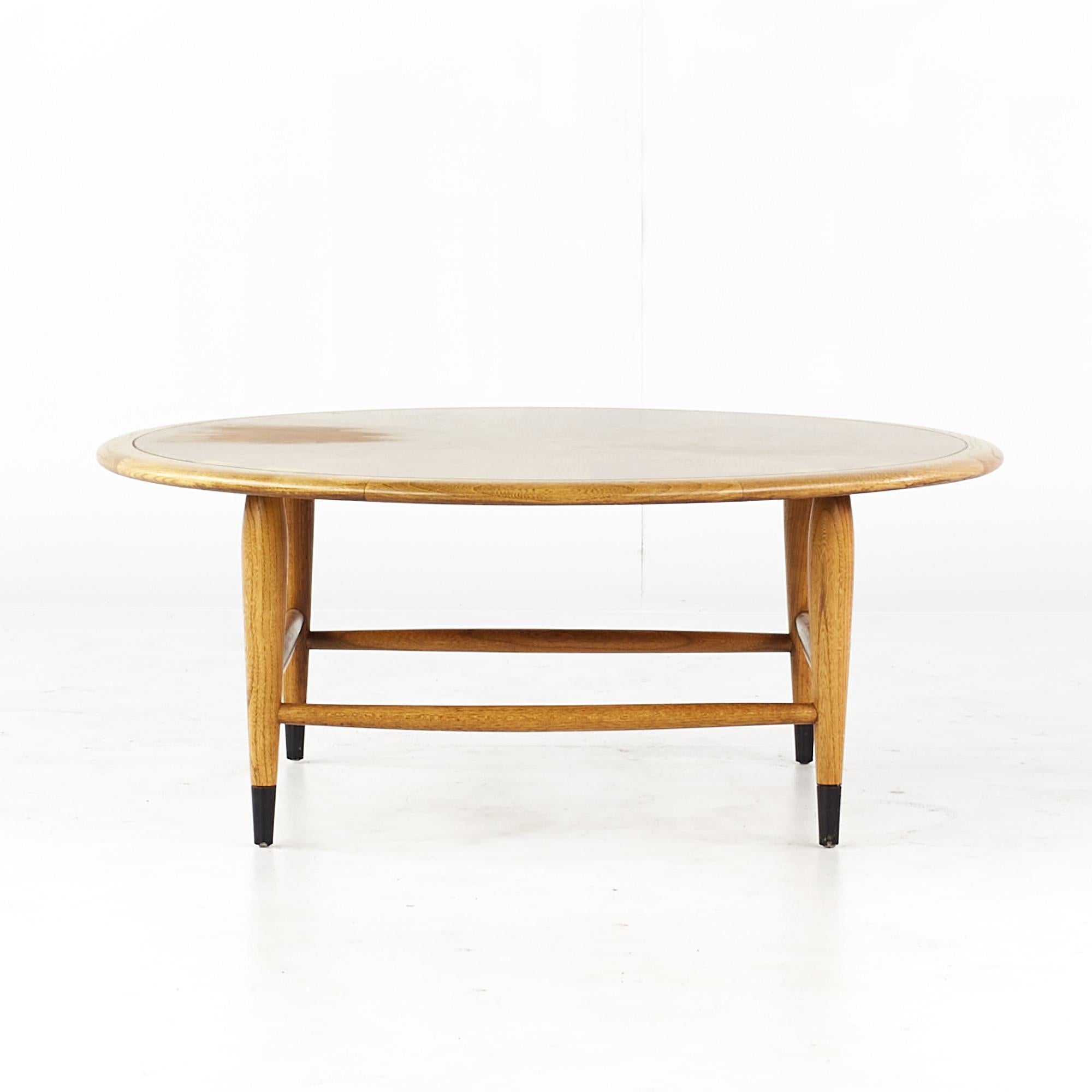 Lane Acclaim mid century round dovetail inlay coffee table

This table measures: 36 wide x 36 deep x 14.5 inches high

All pieces of furniture can be had in what we call restored vintage condition. That means the piece is restored upon purchase