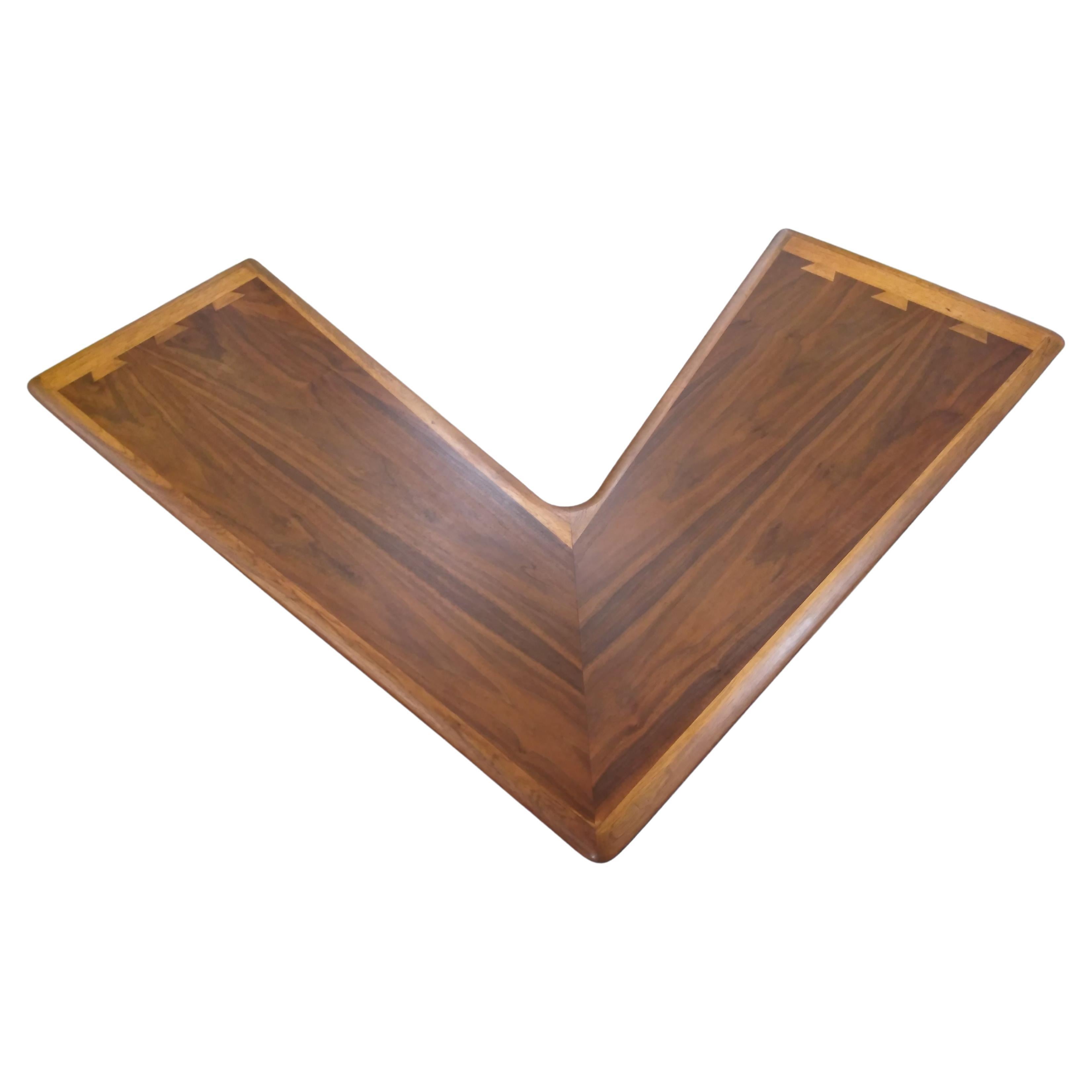 Lane Acclaim mid century walnut DoveTail boomerang coffee table

Classic design with dovetail ends by Andre Bus for Lane Acclaim. The table features walnut and ashwood grain.
Tapered legs with ebonized feet.
   
