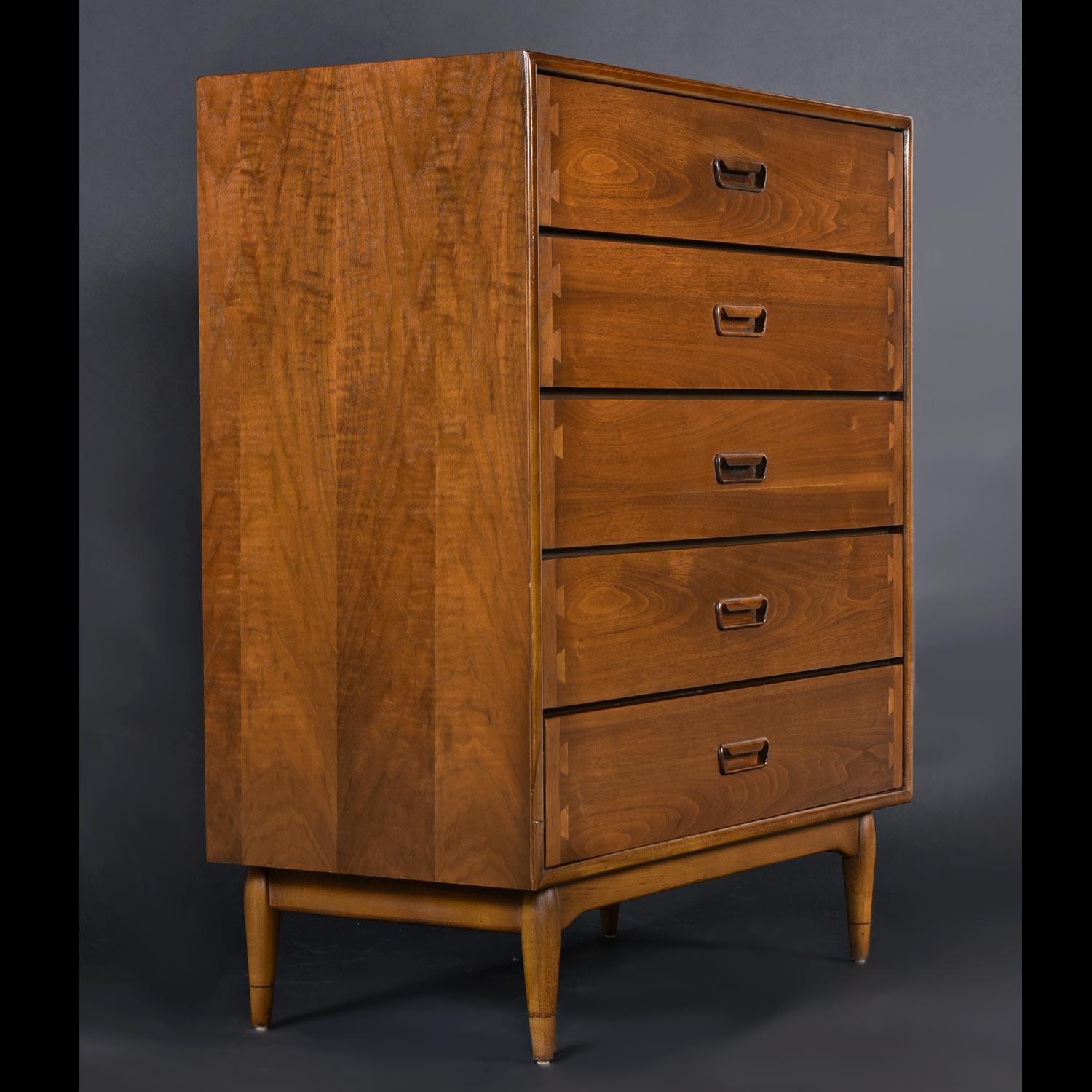 This is a seriously hard-to-find model. The Acclaim bedroom case pieces seldom come to market. After a decade in the MCM furniture business, this is the first one we’ve had on our showroom. Much like the trademark dovetails, the dark tawny recessed