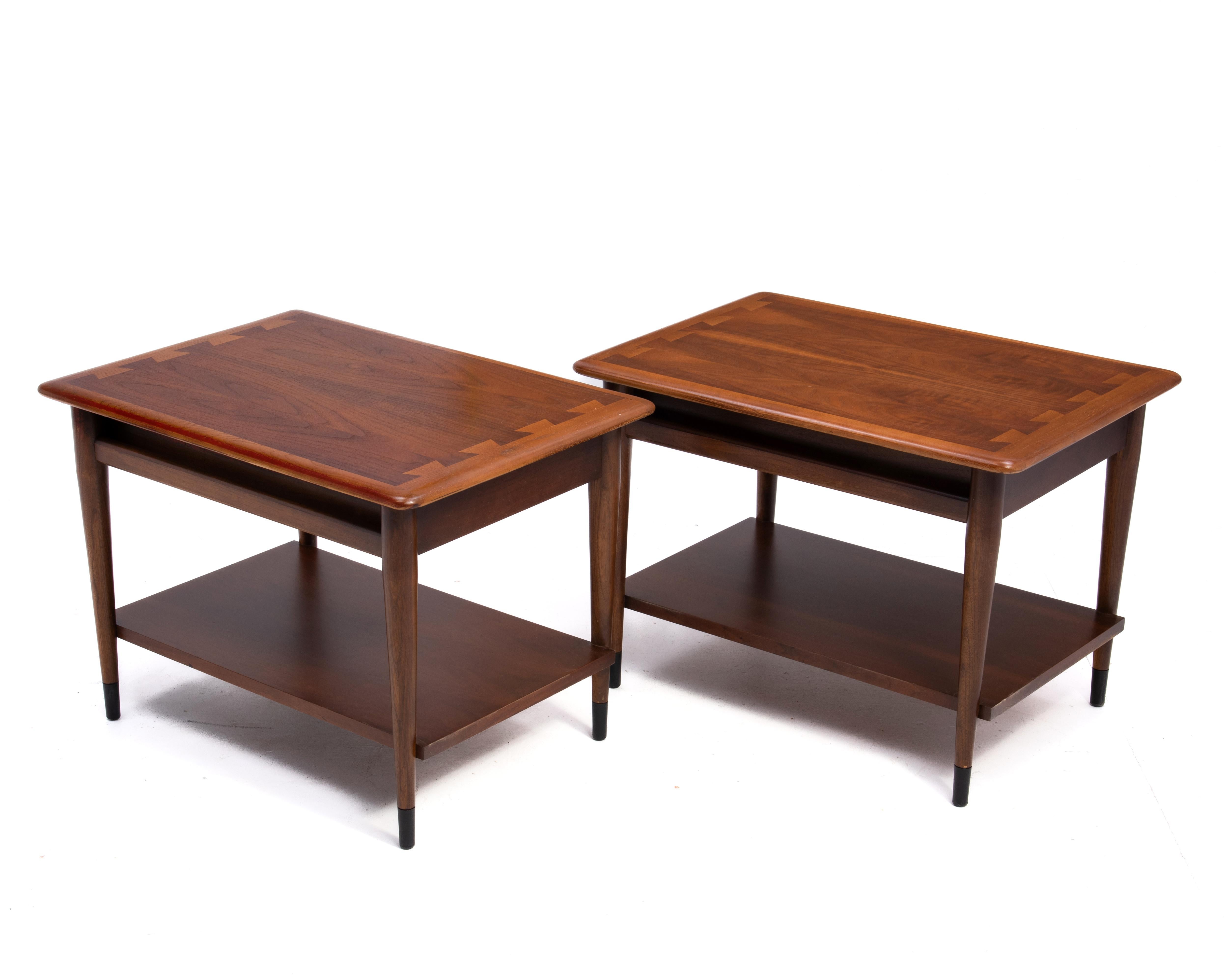 A pair of Acclaim end tables with a single drawer, designed by Andre Bus for Lane Furniture in Altavista Virginia. Iconic and well made, this pair of tables feature wonderful book matched walnut tops.