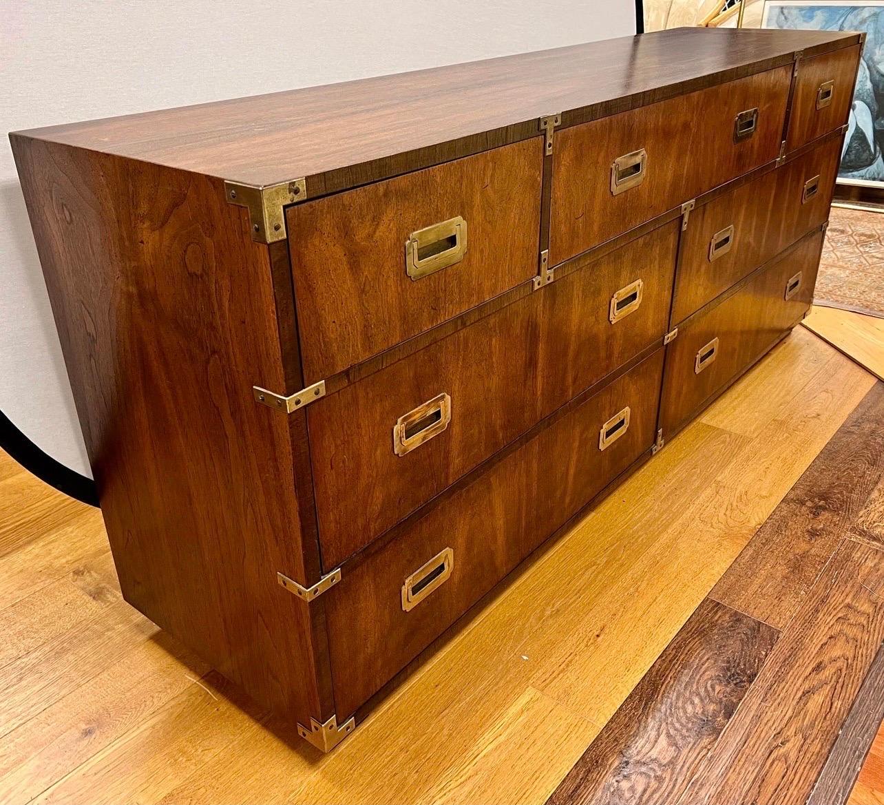 Vintage Lane Altavista campaign style walnut dresser with seven dovetailed drawers and recessed brass pulls and hardware.  Iconic in every way!  Great condition.  See Dibs for our matching tall chest as well.