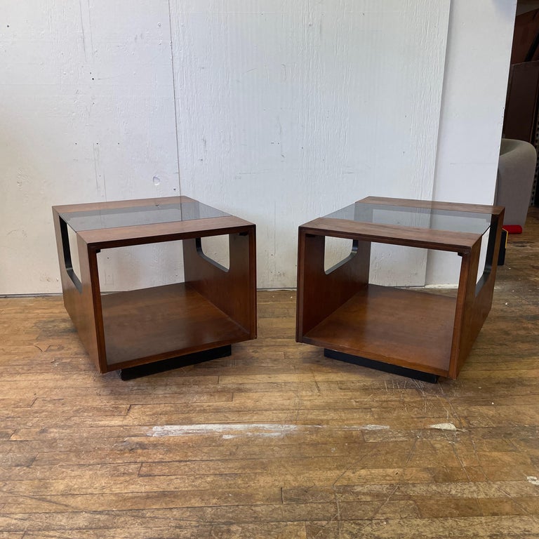 A pretty pair of Lane Altavista end tables made of walnut and glass. These rectangular tables offer storage and style. The smoke glass inserts can be removed for easy cleaning and will save you the hassle of having to use a coaster. The tables are
