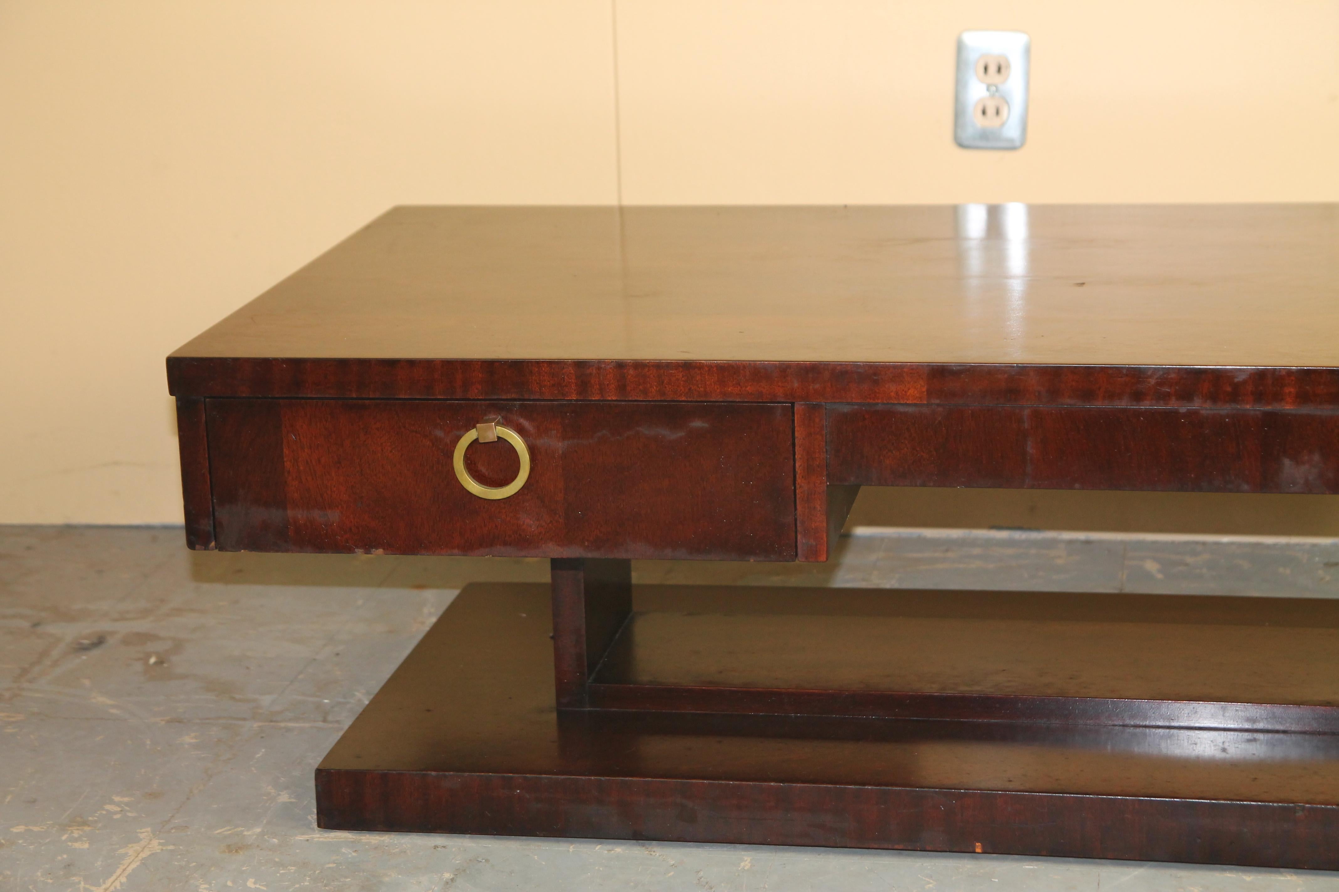 Great mahogany Cubist style coffee table from Lane with draw and brass pull. Marked Lane Altavista, VA in draw.