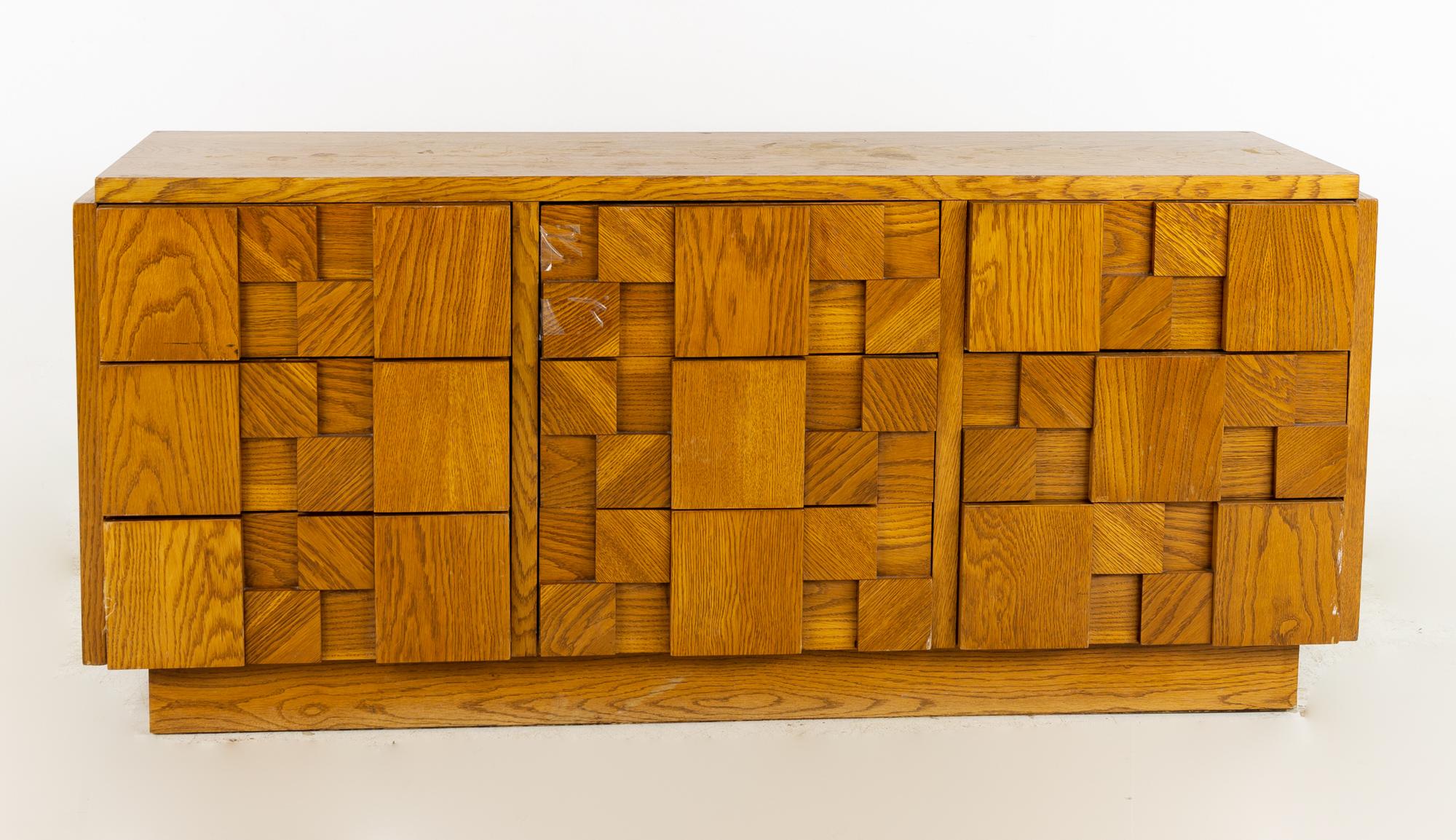 Lane Brutalist mid century oak lowboy dresser

This dresser measures: 68 wide x 18.75 deep x 30.25 inches high.