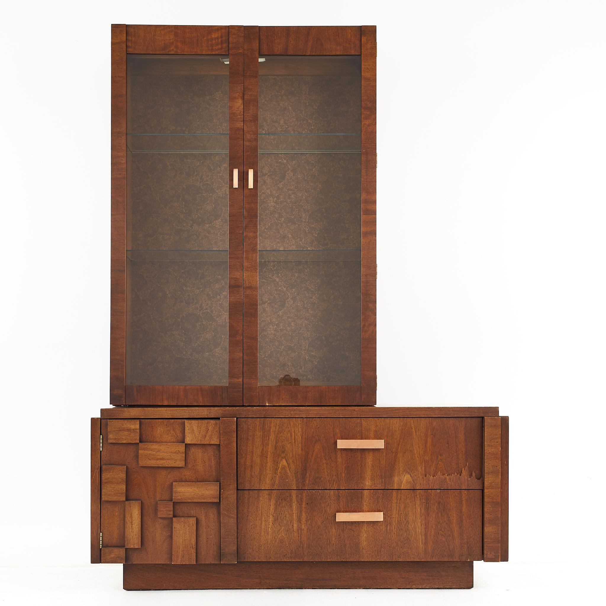 Lane Brutalist mid century offset walnut buffet and hutch

The buffet measures: 54.25 wide x 18.5 deep x 24 inches high 
The hutch measures: 36.25 wide x 12 deep x 52 inches high

All pieces of furniture can be had in what we call restored