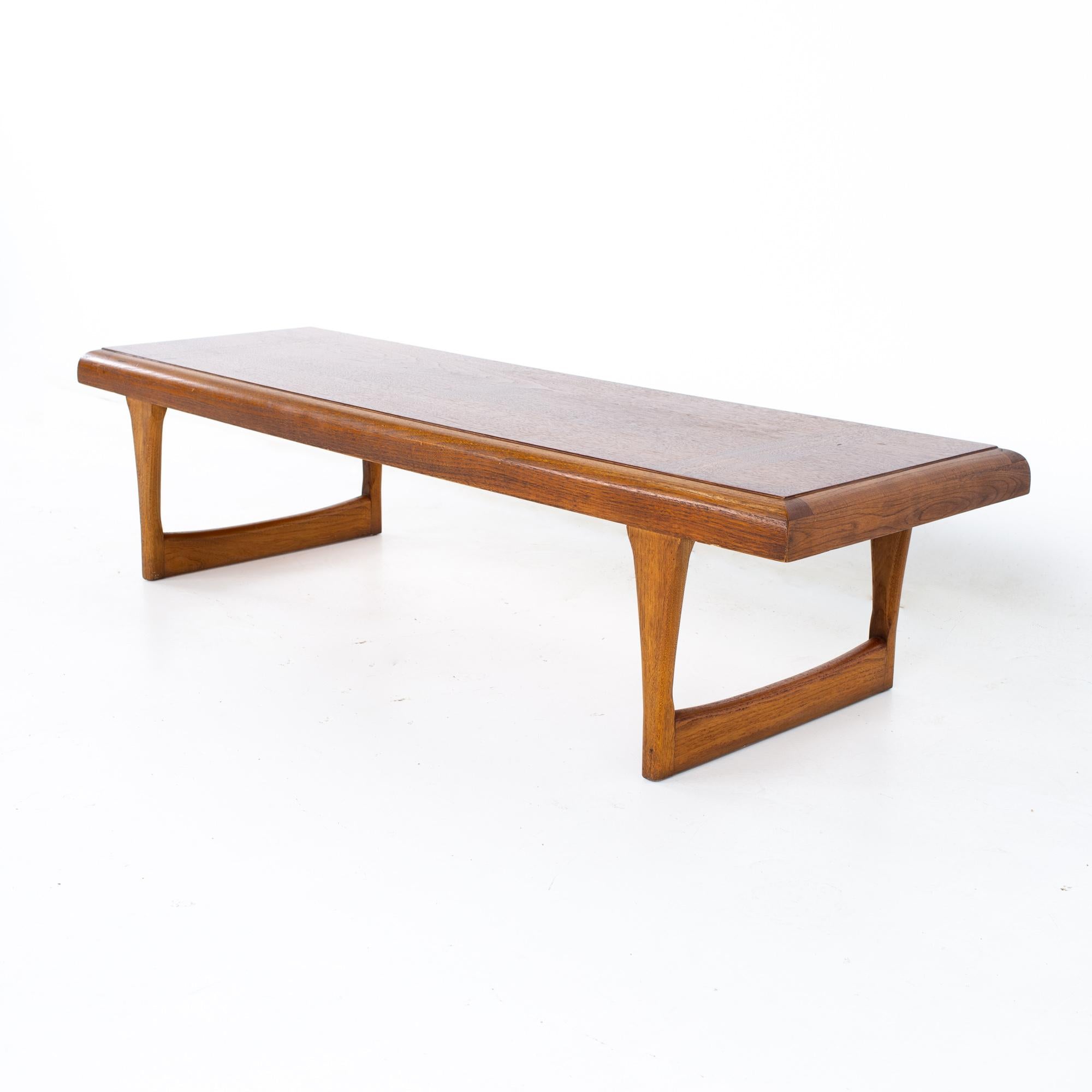 Lane Danish style Mid Century walnut sleigh leg coffee table
Coffee table measures: 60 wide x 20.5 deep x 14.5 inches high

All pieces of furniture can be had in what we call restored vintage condition. That means the piece is restored upon
