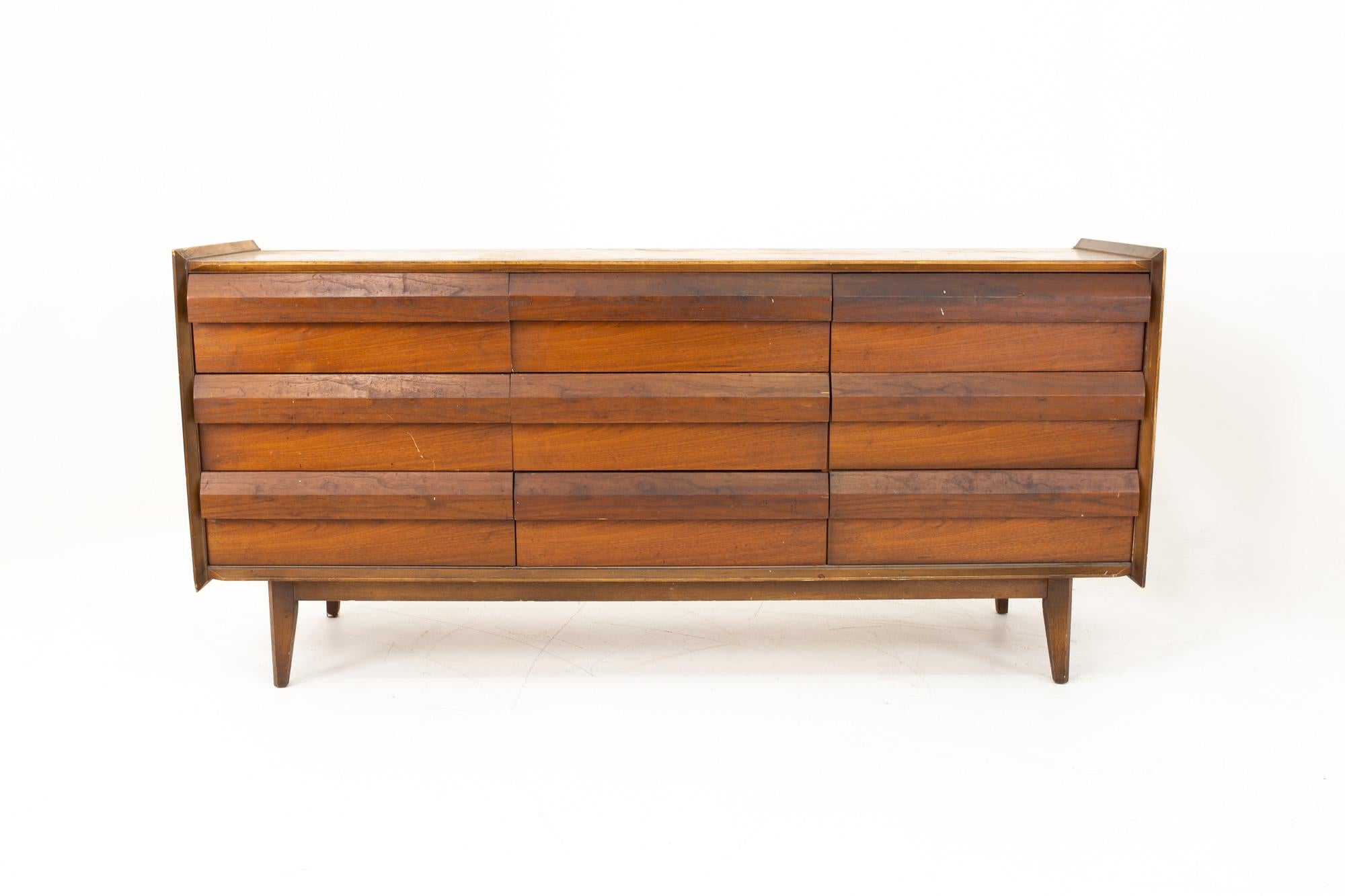 Lane first edition midcentury walnut 9-drawer lowboy dresser

Dresser measures: 66 wide x 18 deep x 30 high

This price includes getting this piece in what we call restored vintage condition. That means the piece is permanently fixed upon