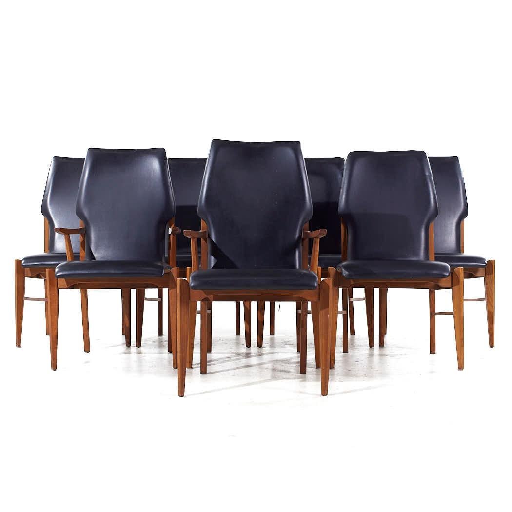 Lane First Edition Mid Century Walnut Dining Chairs - Set of 8

Each armless chair measures: 23 wide x 22.5 deep x 38.5 high, with a seat height of 18.75 inches
Each captains chair measures: 23 wide x 22.5 deep x 38.5 high, with a seat height of