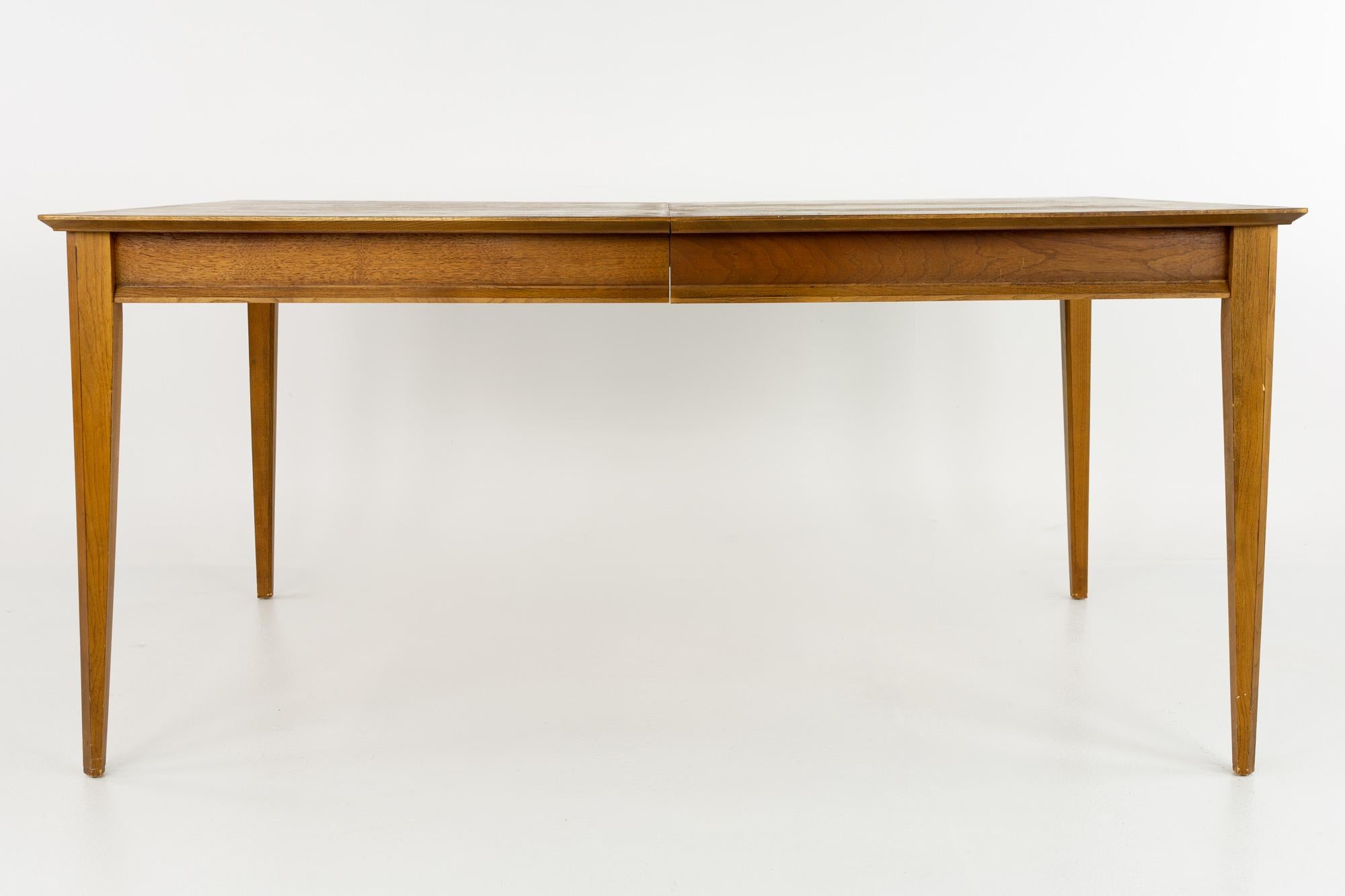 Lane first edition mid century walnut dining table with 2 leaves

This table measures: 62 wide x 40 deep x 29.25 inches high, with a chair clearance of 25 inches; the leaf is 18 inches wide, making a maximum table width of 98 inches

?All pieces
