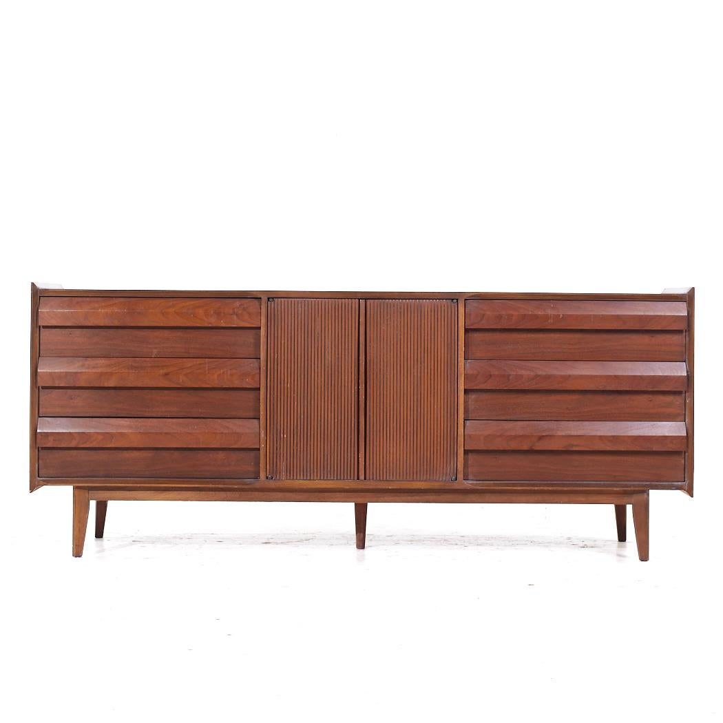 Lane First Edition Mid Century Walnut Lowboy Dresser

This lowboy measures: 74 wide x 18 deep x 30.75 inches high

All pieces of furniture can be had in what we call restored vintage condition. That means the piece is restored upon purchase so it’s