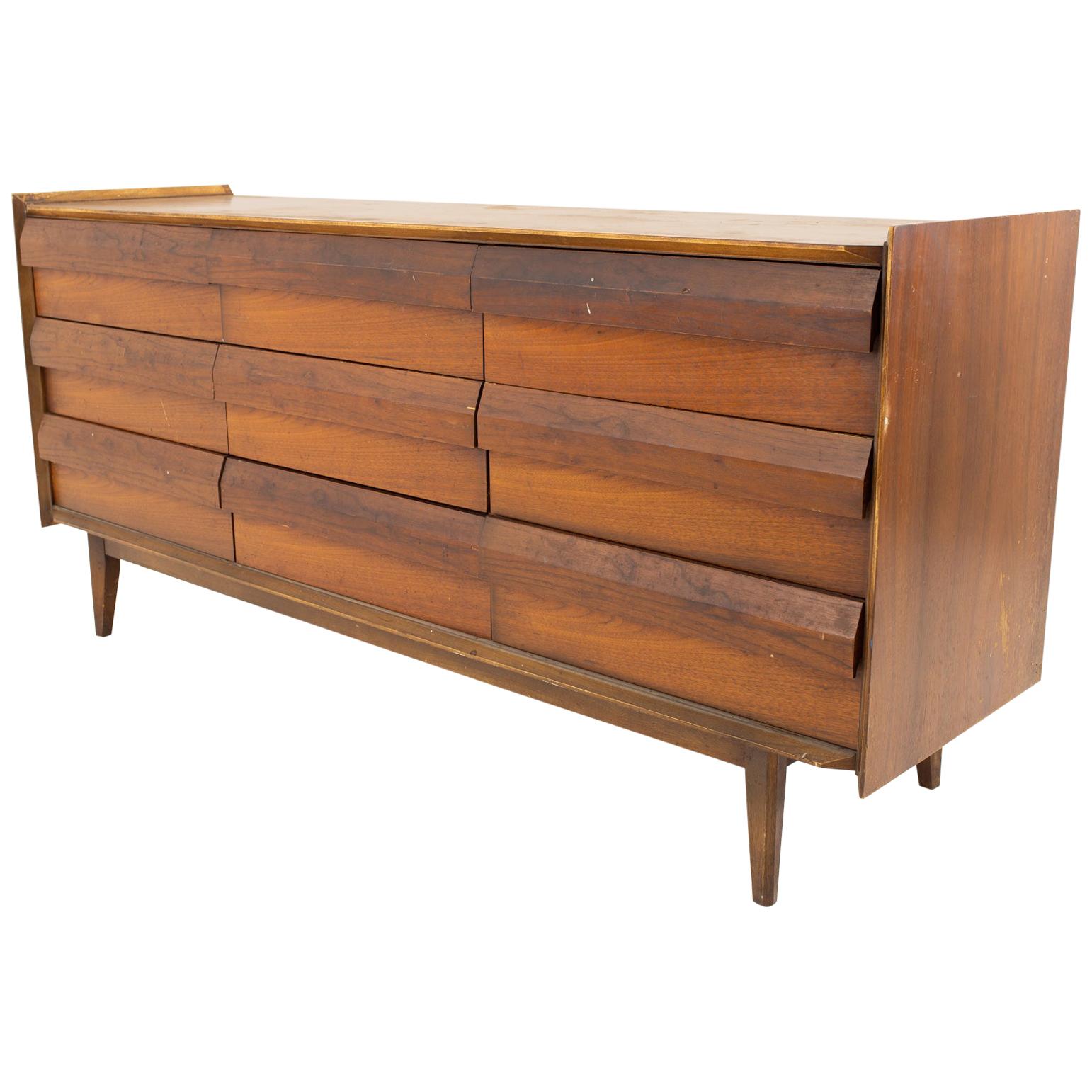 Lane first edition midcentury walnut 9-drawer lowboy dresser
Dresser measures: 66 wide x 18 deep x 30 high

This price includes getting this piece in what we call restored vintage condition. That means the piece is permanently fixed upon purchase