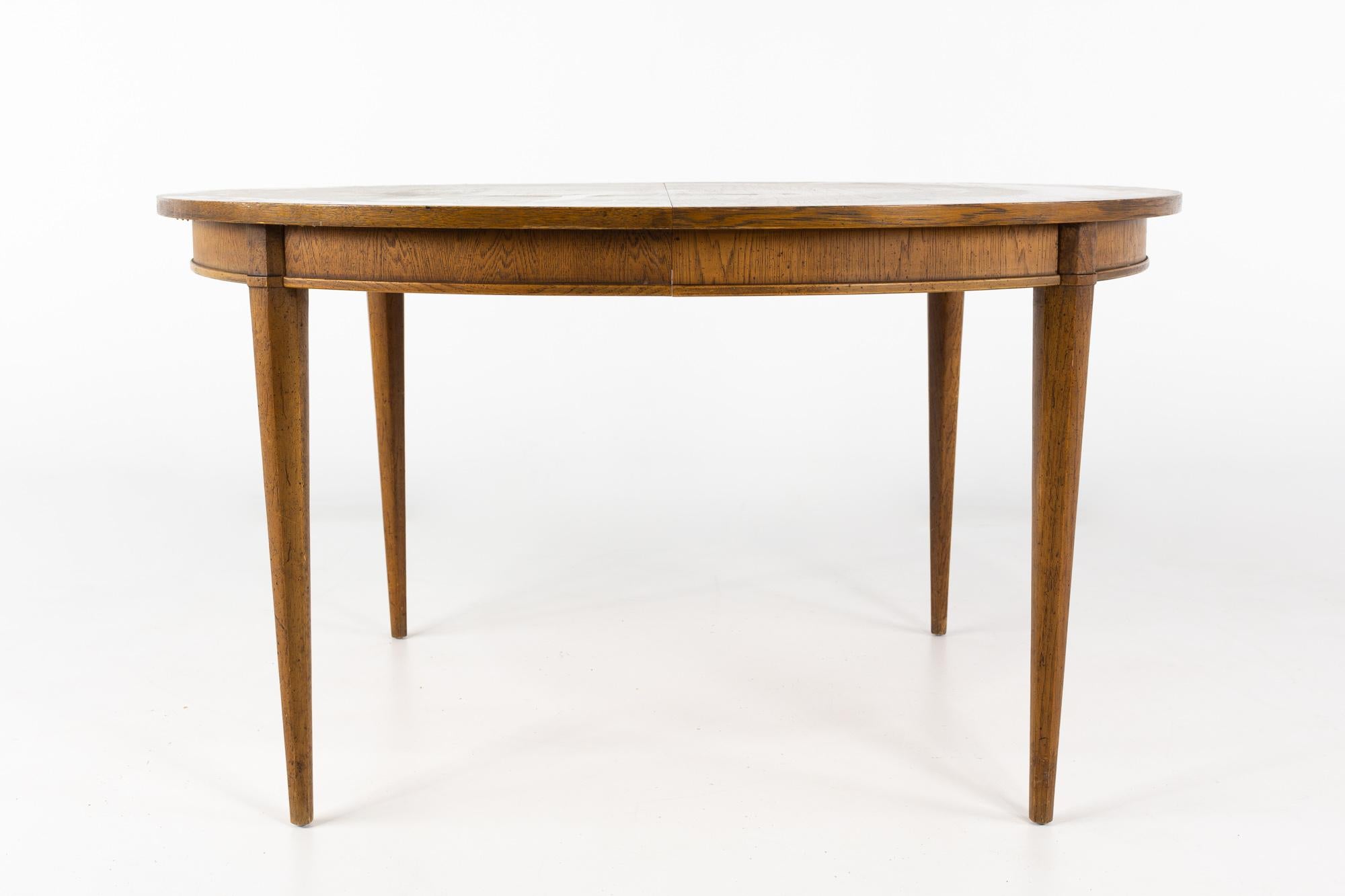 Lane First Edition Style Mid Century walnut dining table with 2 Leaves

This table measures: 53 wide x 45 deep x 29.5 inches high, with a chair clearance of 25.5 inches, each leaf measures 20 inches wide, making the maximum table width of 93