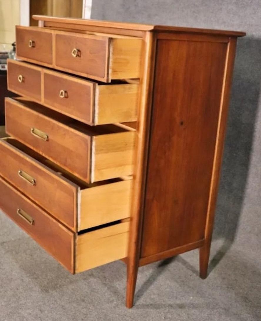 Tall mid-century modern chest of drawers by Lane Furniture. Walnut wood with pecan trim and brass hardware.
Please confirm location NY or NJ