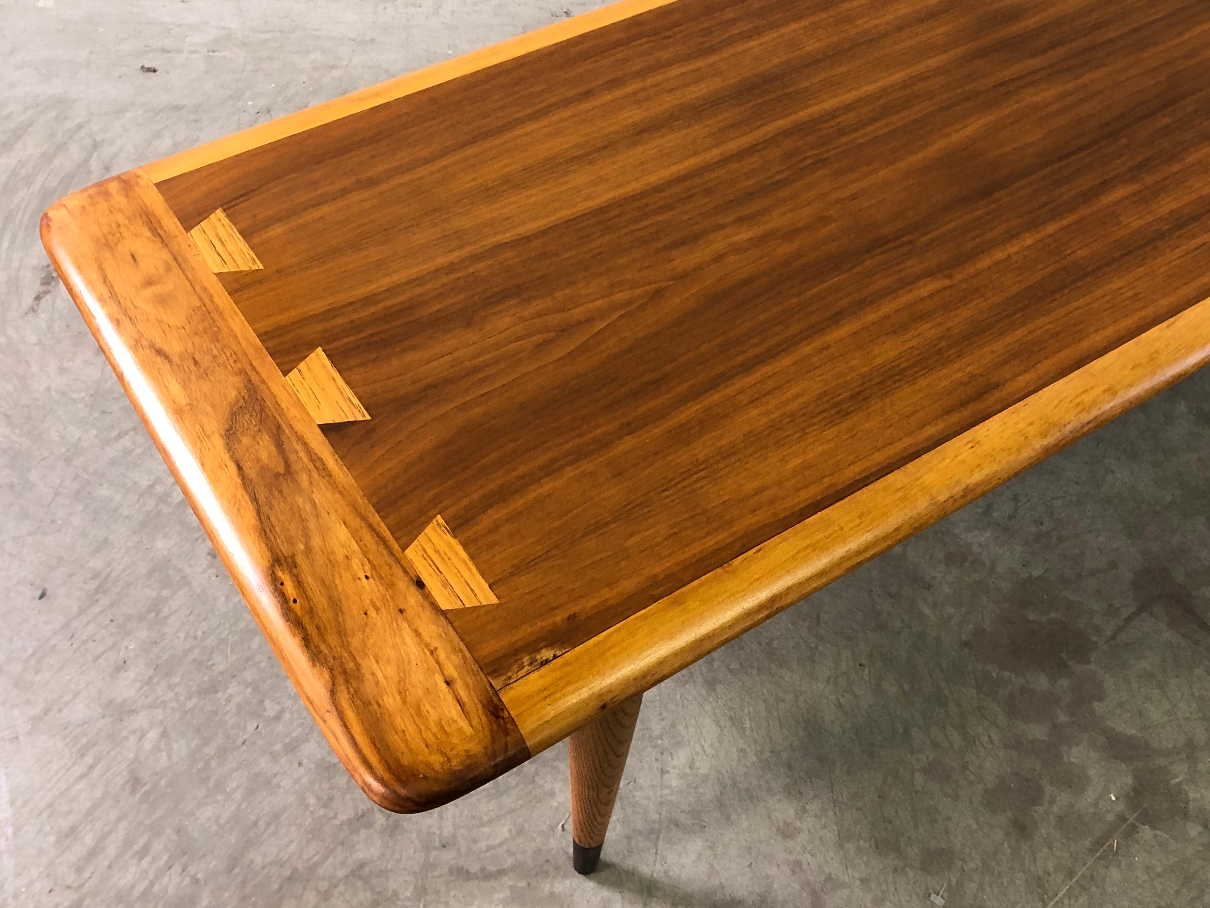 Vintage 1960s walnut and ashwood dovetailed coffee table by Lane Furniture Co. Newly refinished and in excellent condition. Marked underneath.