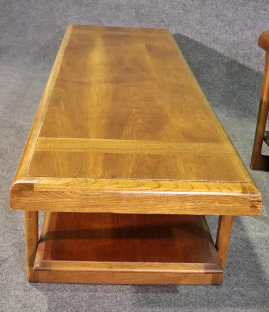 Mid-century modern two level coffee table by Lane Furniture. Warm walnut grain throughout with a bottom storage shelf.
Please confirm location NY or NJ