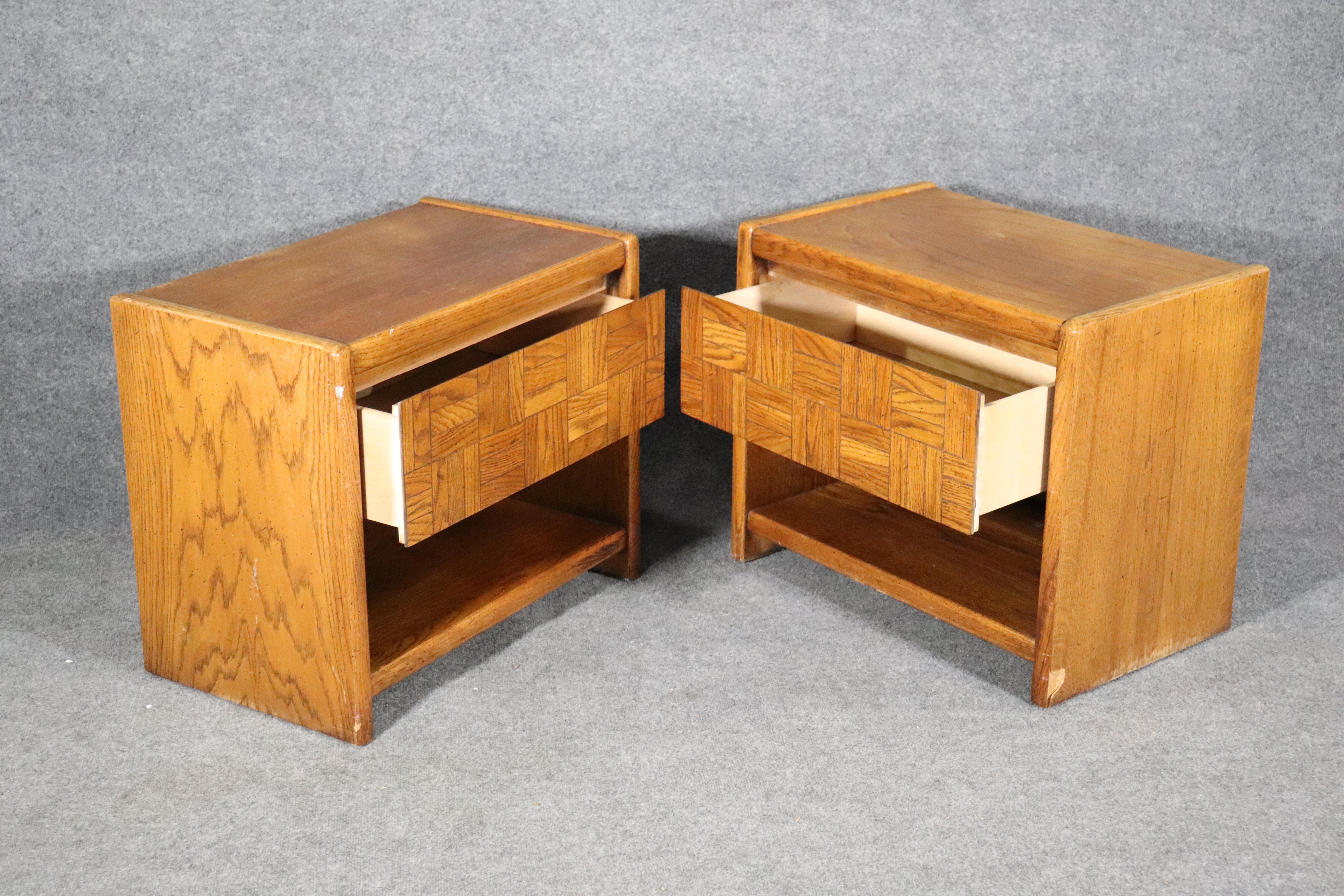 Pair of mid-century end tables by Lane Furniture. Oak wood grain with tile motif drawers.
Please confirm location NY or NJ