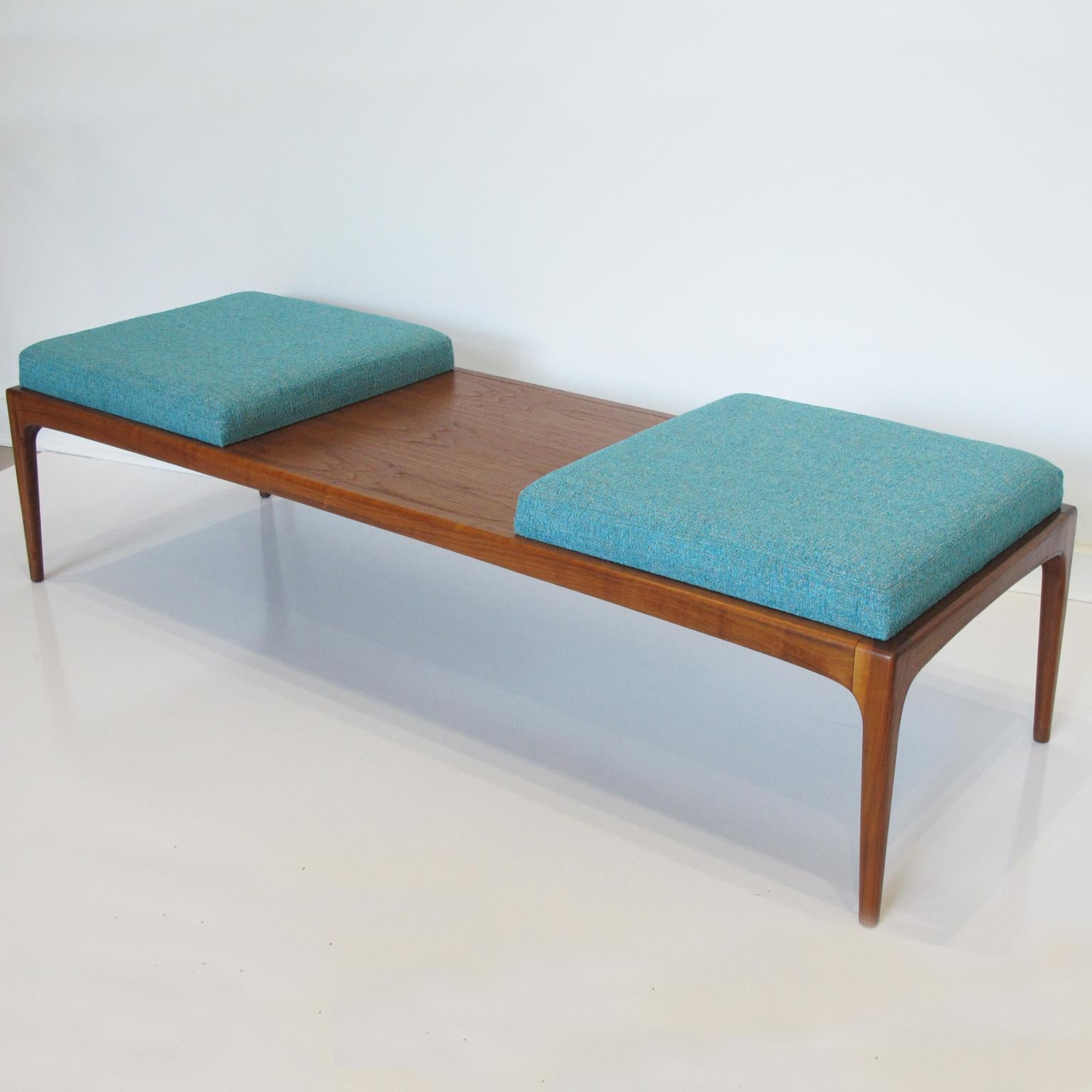 Extra long Mid-Century Modernist bench newly upholstered, designed by Lane Furniture. Walnut base fully restored. This lovely bench consists of three sections; two fabric cushion seats in stunning turquoise color with textured pattern and one walnut