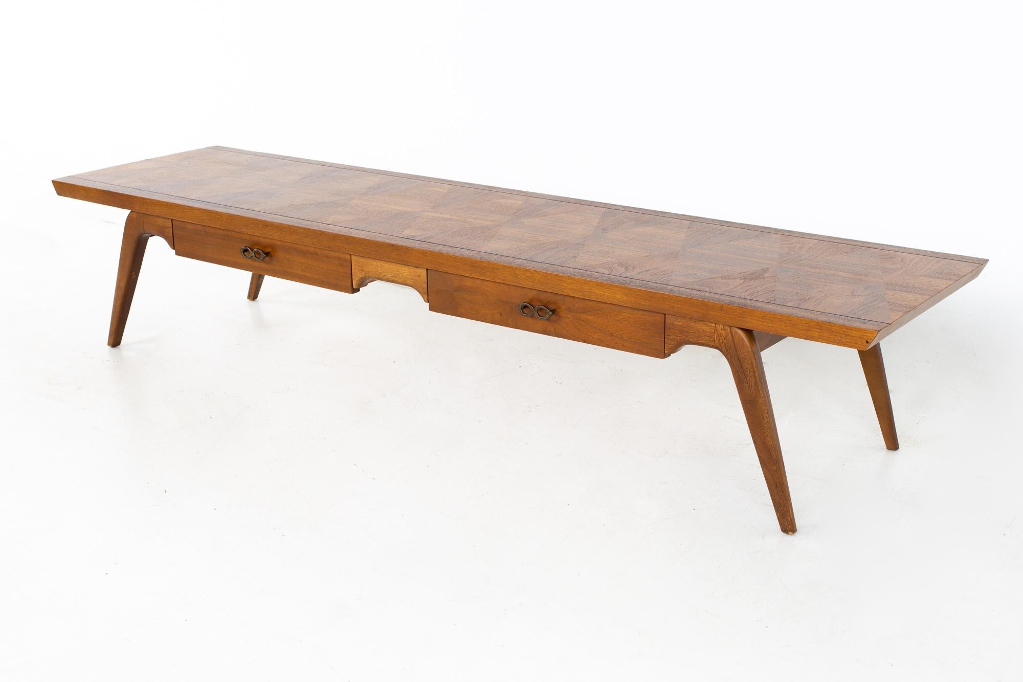 Lane Harlequin mid century long walnut and brass coffee table
Table measures: 70 wide x 18 deep x 13.5 inches high

All pieces of furniture can be had in what we call restored vintage condition. That means the piece is restored upon purchase so