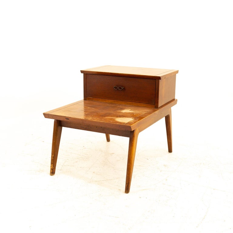 Lane Harlequin mid century walnut step side end table

End table measures: 21 wide x 28.75 deep x 22 high 

All pieces of furniture can be had in what we call restored vintage condition. That means the piece is restored upon purchase so it’s