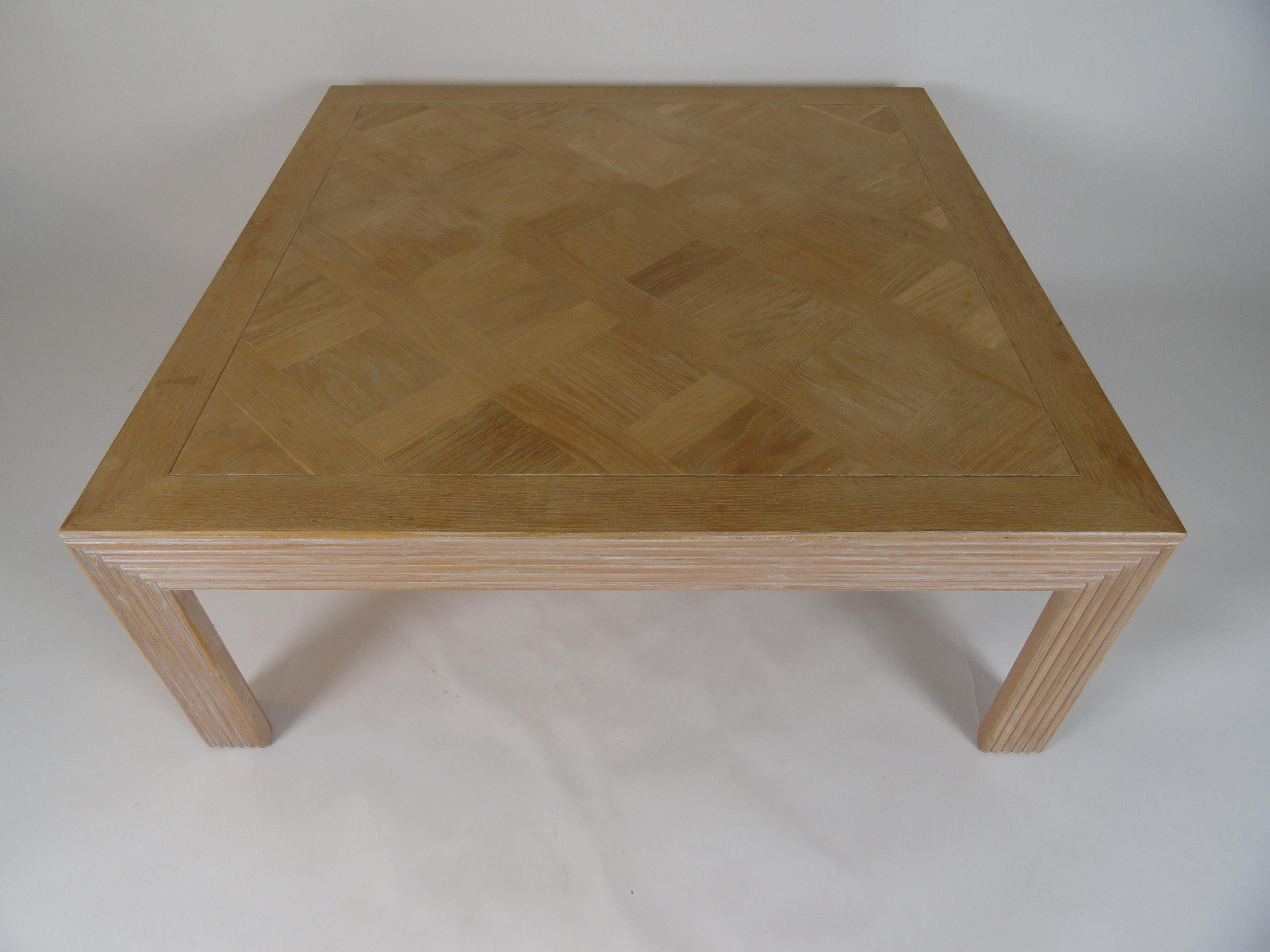 Lane furniture inlaid bleached wood square coffee table with fluted wood leg detail.
Stamped on bottom. Bleached top shows slight variations in finish across the piece.
