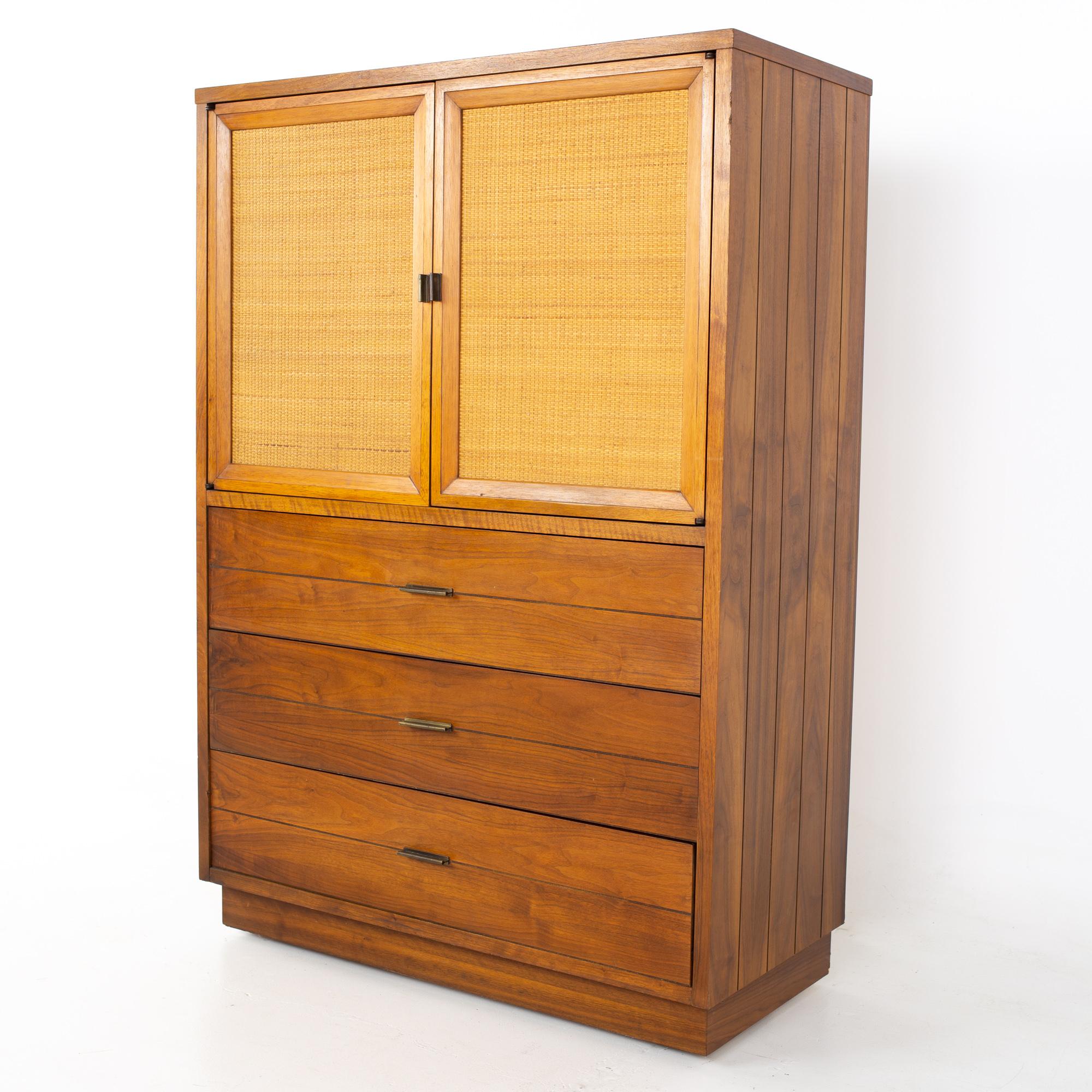 Lane mid century walnut and cane plinth base armoire gentleman's chest highboy dresser
Dresser measures: 39.25 wide x 18 deep x 56.5 inches high

All pieces of furniture can be had in what we call restored vintage condition. That means the piece