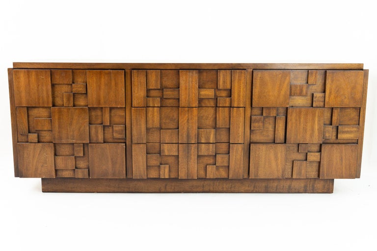 Lane Mid Century brutalist staccato 9 drawer lowboy dresser credenza 

This credenza measures: 78.5 wide x 18.75 deep x 30.5 high

All pieces of furniture can be had in what we call restored vintage condition. That means the piece is restored