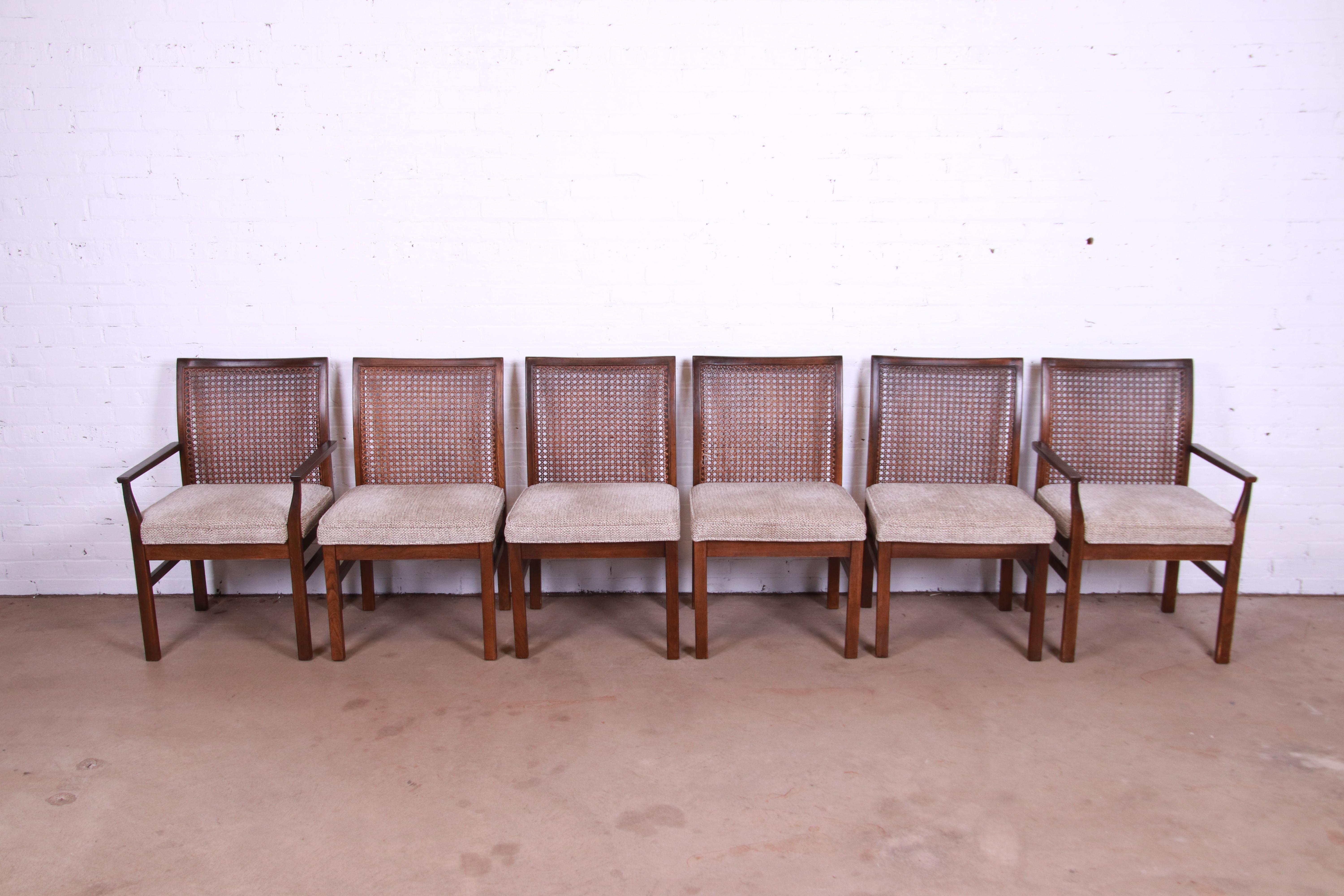 A gorgeous set of six Mid-Century Modern dining chairs

By Lane Furniture

USA, Circa 1960s

Walnut frames, with caned backs and upholstered seats.

Measures:
Side chairs - 21