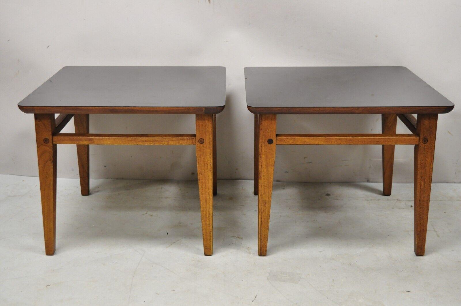 Lane Mid-Century Modern walnut black laminate top low side end tables - a pair. Circa mid-20th century. Measurements: 14.5