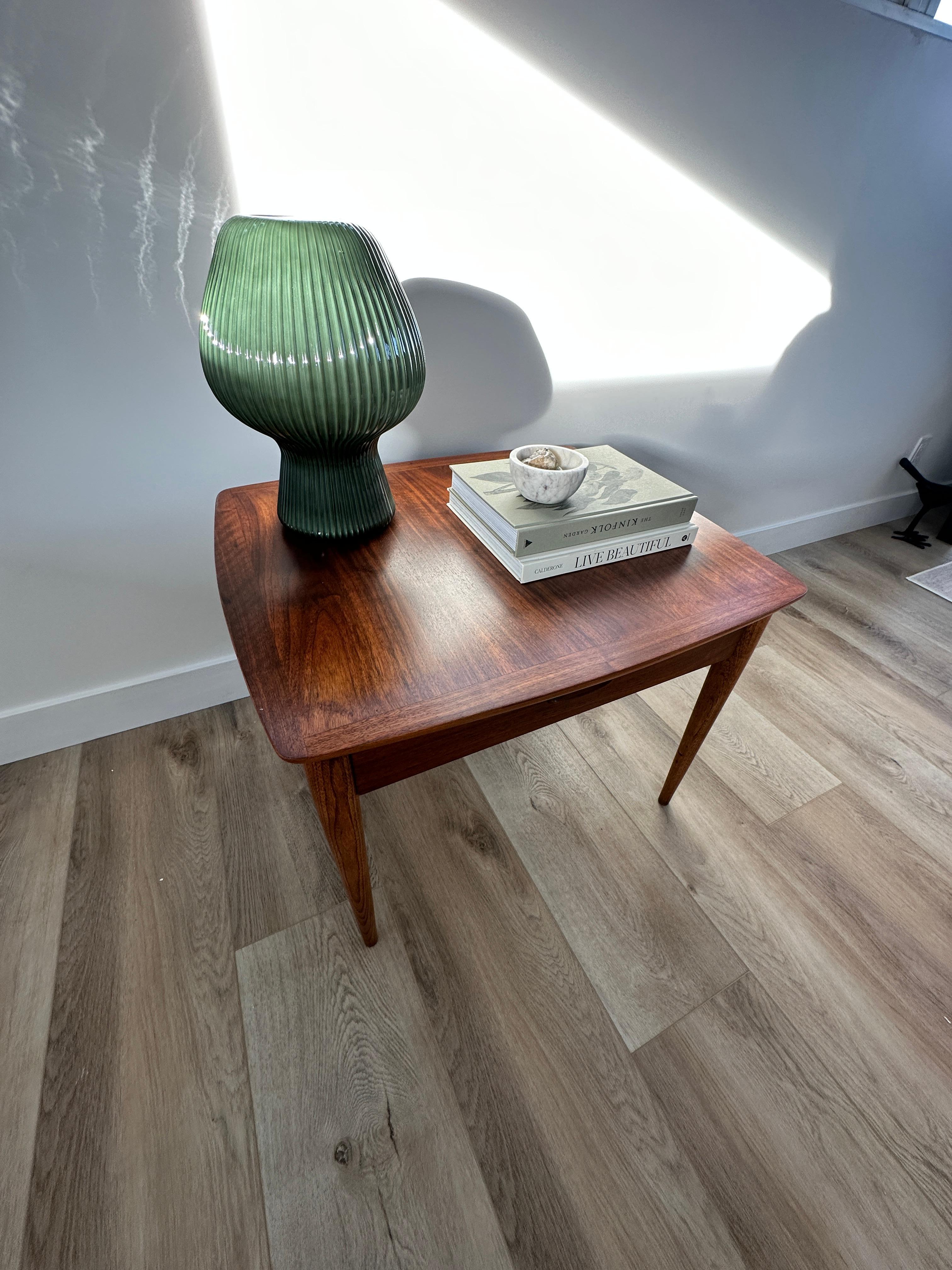 truly beautiful side table , night stand in walnut with gorgeous dovetail detail in the drawer design and build . this piece has been carefully restored to its original lustre. Lane acclaim 1963 from the drawer stamp. 