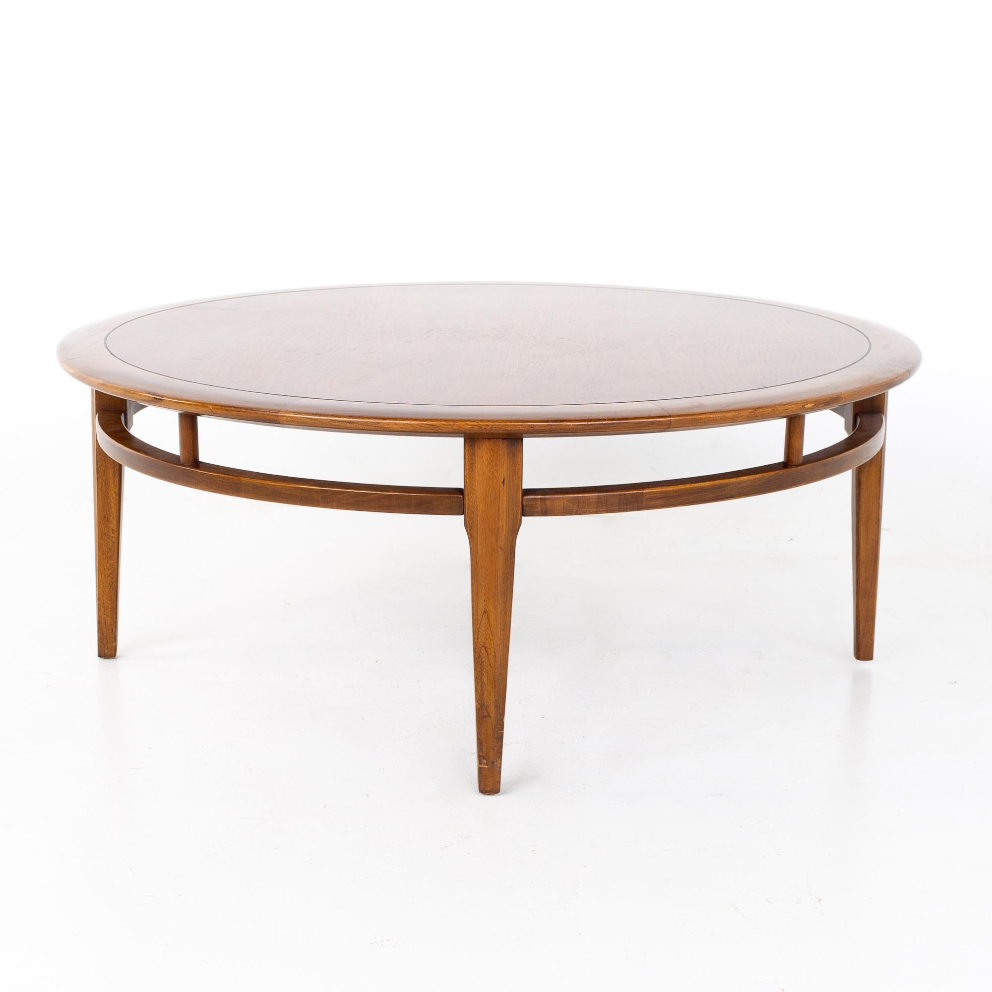 Lane mid century round oak and walnut coffee table
Coffee table measures: 38 wide x 38 deep x 15 inches high

All pieces of furniture can be had in what we call restored vintage condition. That means the piece is restored upon purchase so it’s