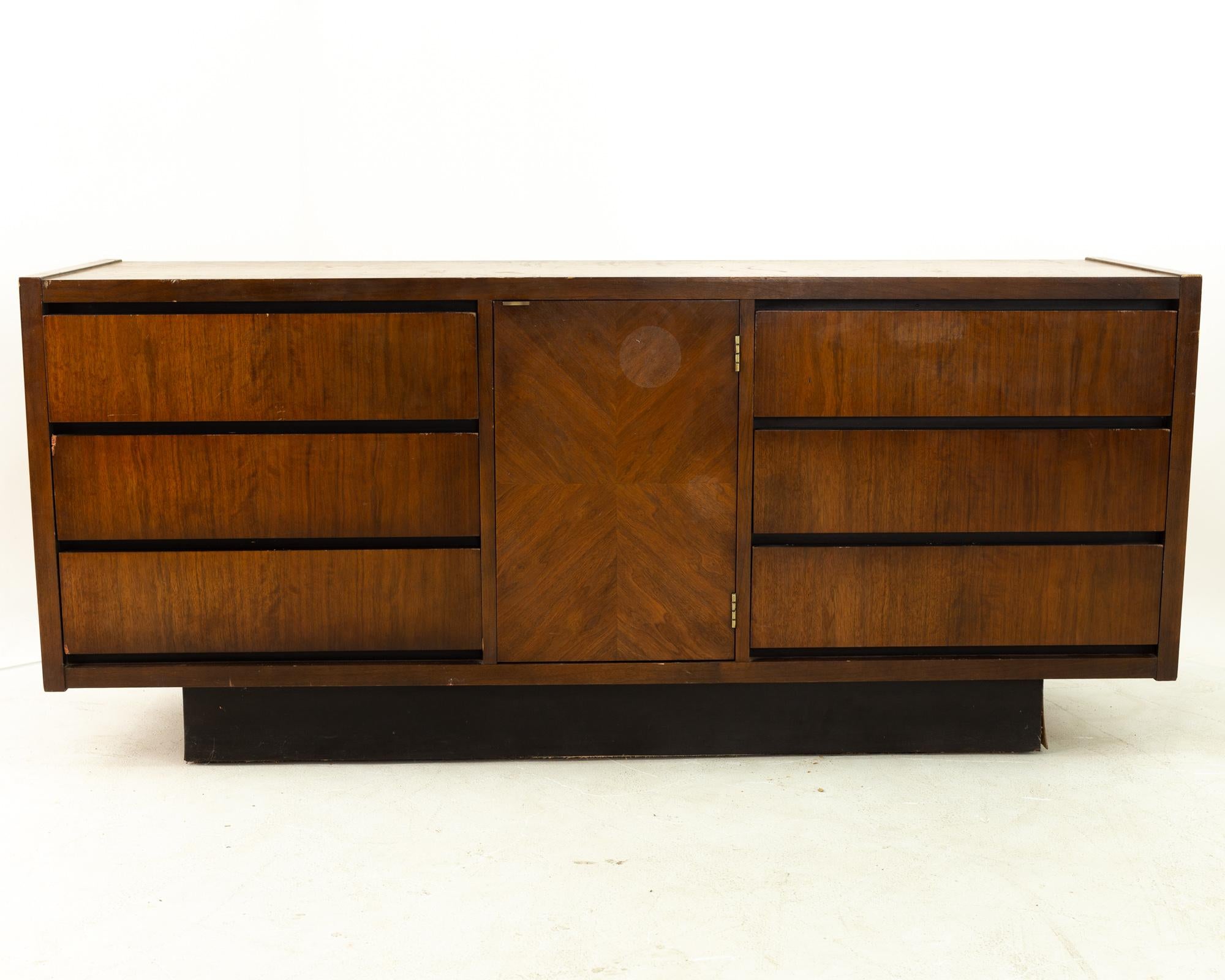 Lane Mid Century walnut 6 drawer lowboy dresser on plinth base 
Measures: 66 wide x 18 deep x 29 high

All pieces of furniture can be had in what we call restored vintage condition. This means the piece is restored upon purchase so it’s free of