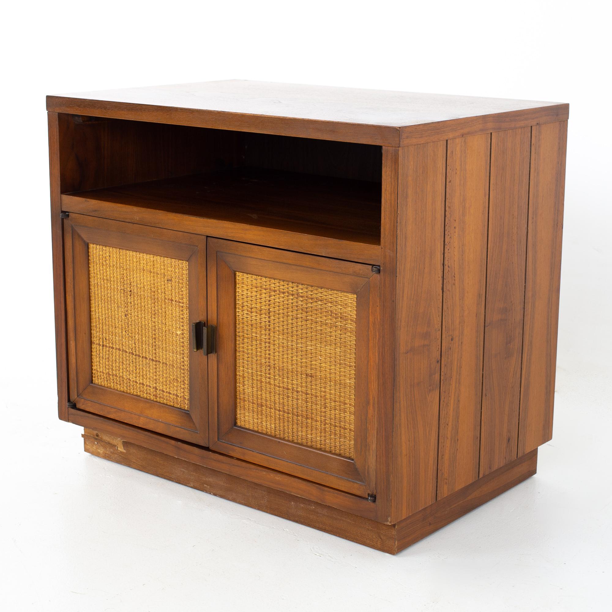 Lane mid century walnut and cane plinth base nightstand
Nightstand measures: 26 wide x 17 deep x 23 inches high

All pieces of furniture can be had in what we call restored vintage condition. That means the piece is restored upon purchase so it’s