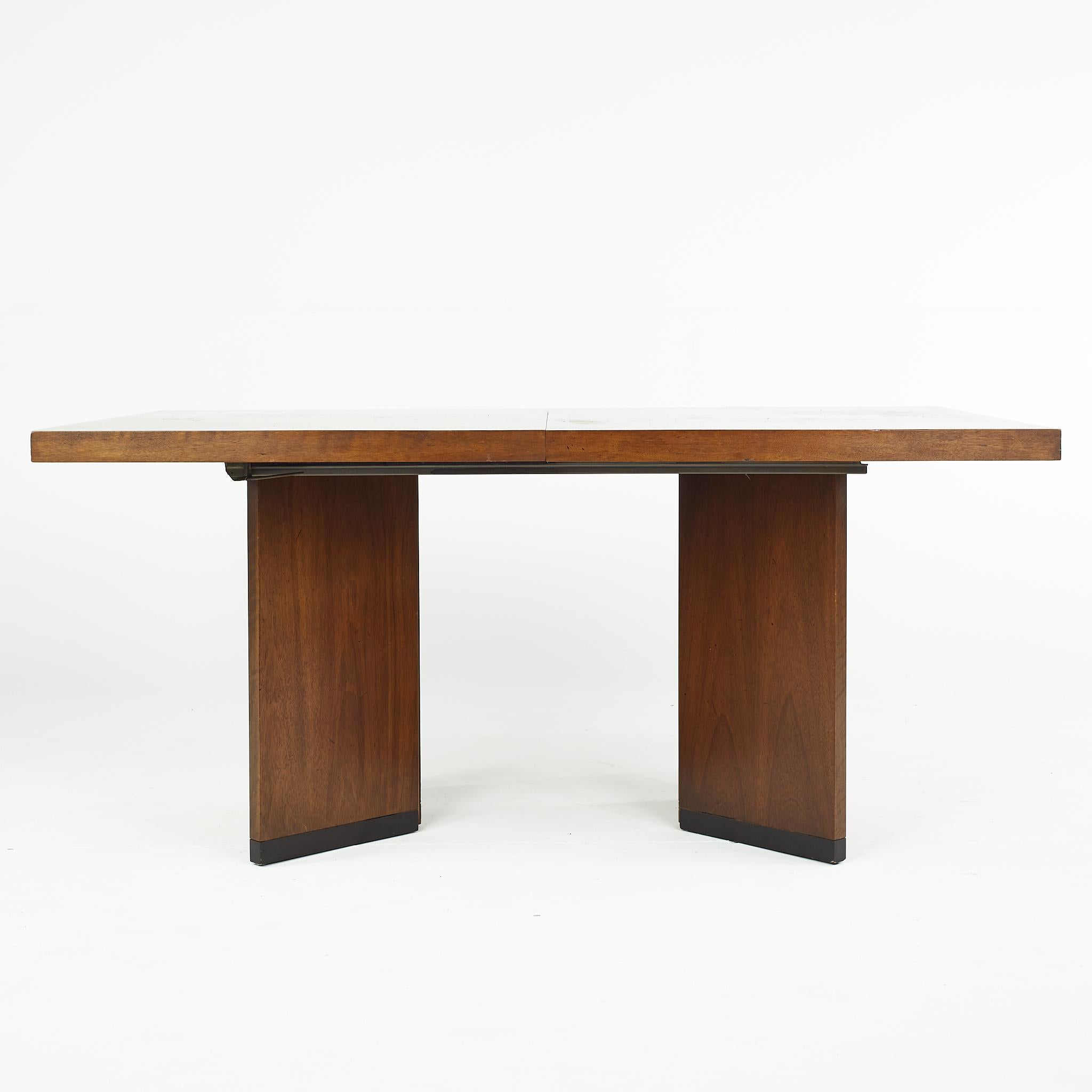 Lane mid century walnut Parquet expanding dining table

This table measures: 71.5 wide x 38 deep x 29.5 inches high; each leaf measures 18 inches wide, making a maximum table width of 107.5 inches when both leaves are used

All pieces of