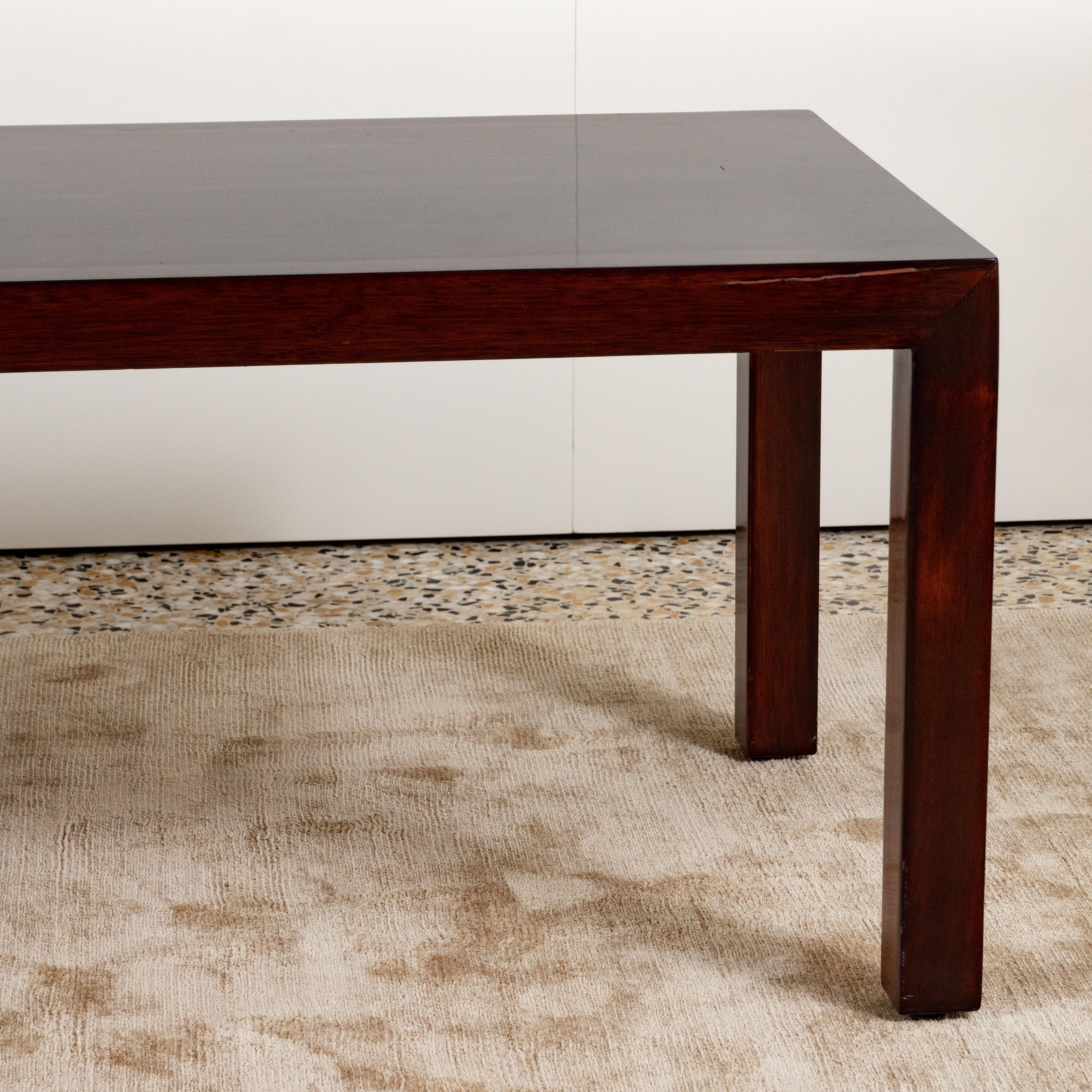 Mahogany coffee table in a Parsons style with rectangular top and square legs by Lane Furniture Company. USA, circa 1950.

Refinished in a dark stain.

Provenance: Originally acquired from Alan Moss Gallery, NYC.

