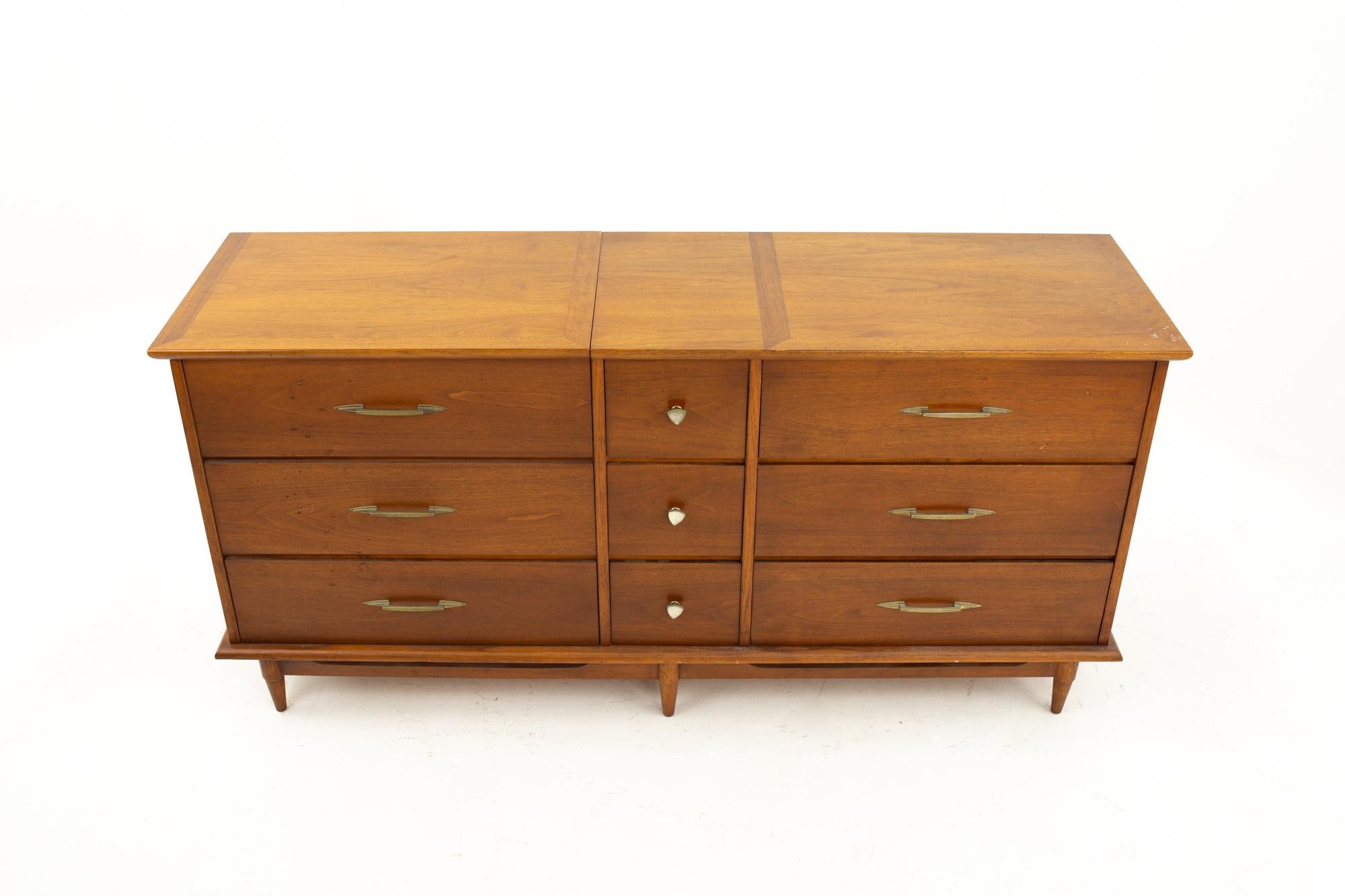 Lane Mid Century lowboy dresser with built in cedar chest
Dresser measures: 66 wide x 19 deep x 32 inches high

This price includes getting this piece in what we call restored vintage condition. That means the piece is permanently fixed upon