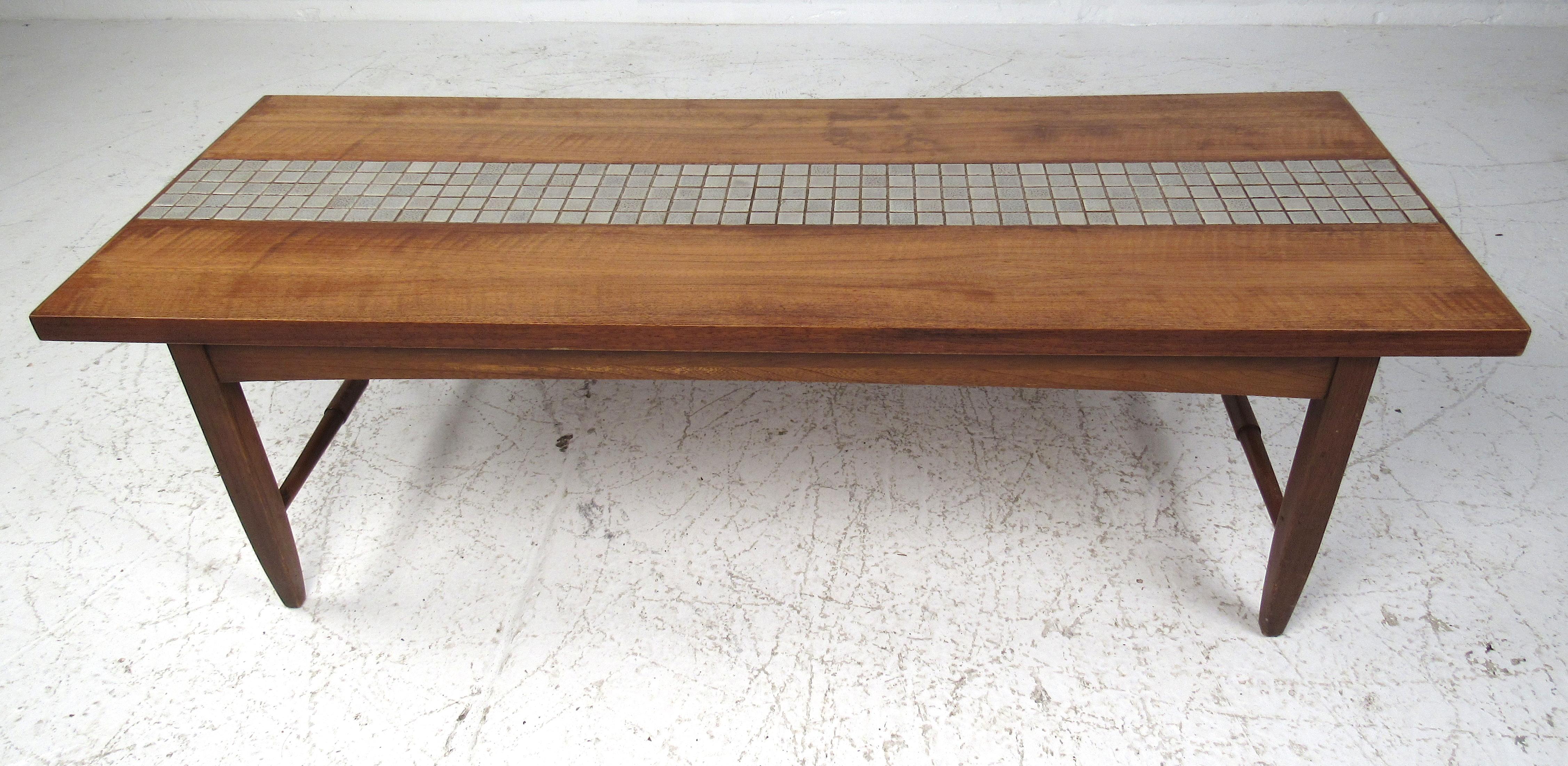 Solid walnut construction with imported Capri grey tile inlay, the Monte Carlo table provides an eye-catching midcentury look in any living room decor. Please confirm item location (NY or NJ) with dealer.