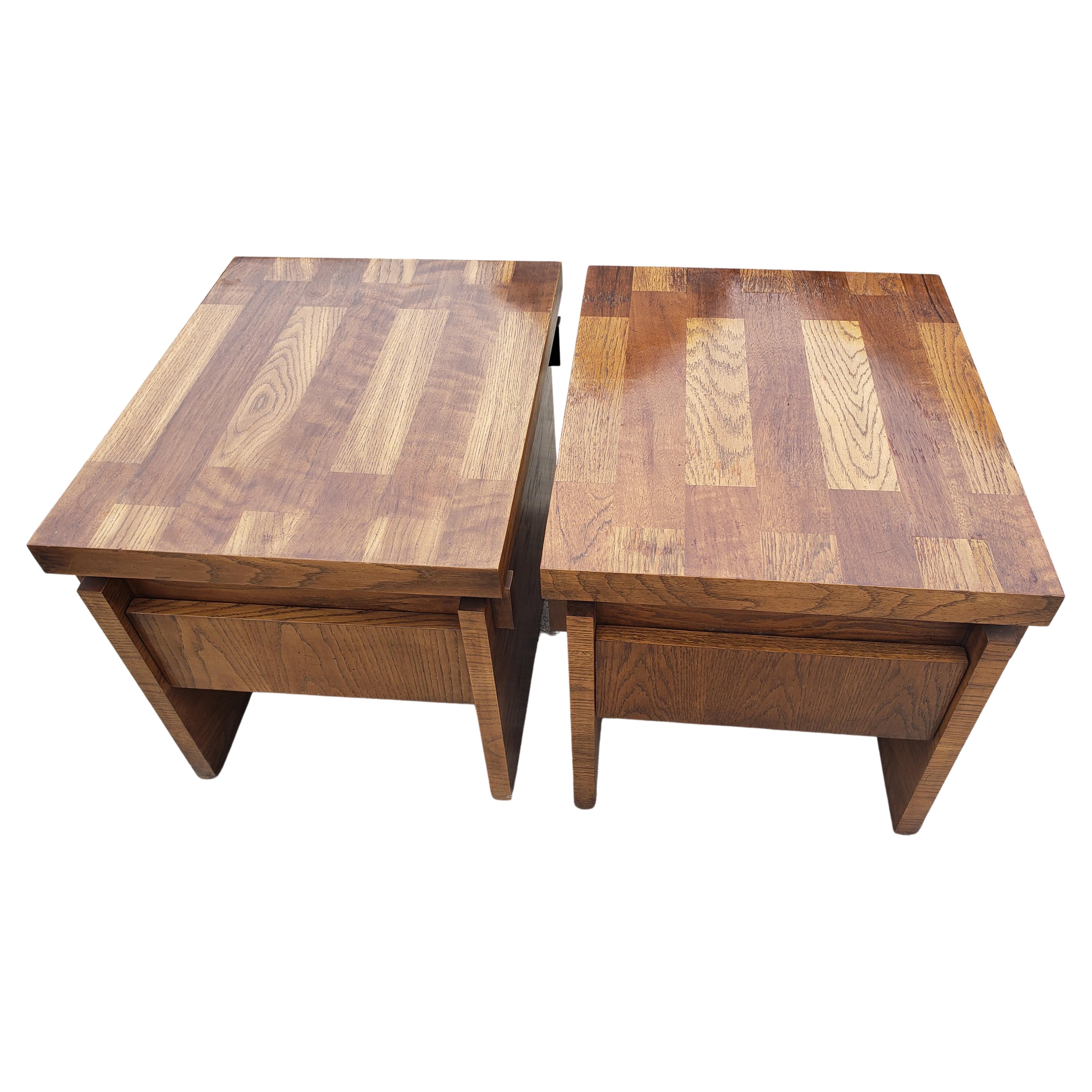 A pair of one drawer Brutalist chunky oak parquetry side tables. 
Very good vintage condition. 
Measure 22