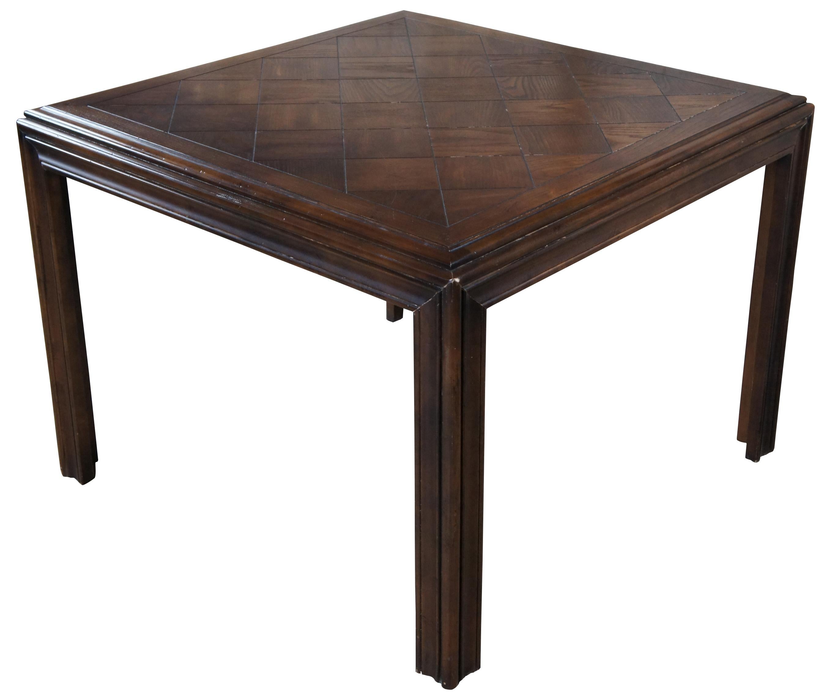 Vintage Lane Altavista Oak MCM dining table. Features a square parson styles form with parquetry top, natural distressing and glass top. Made on 01-27-78 in plant number 4.
 