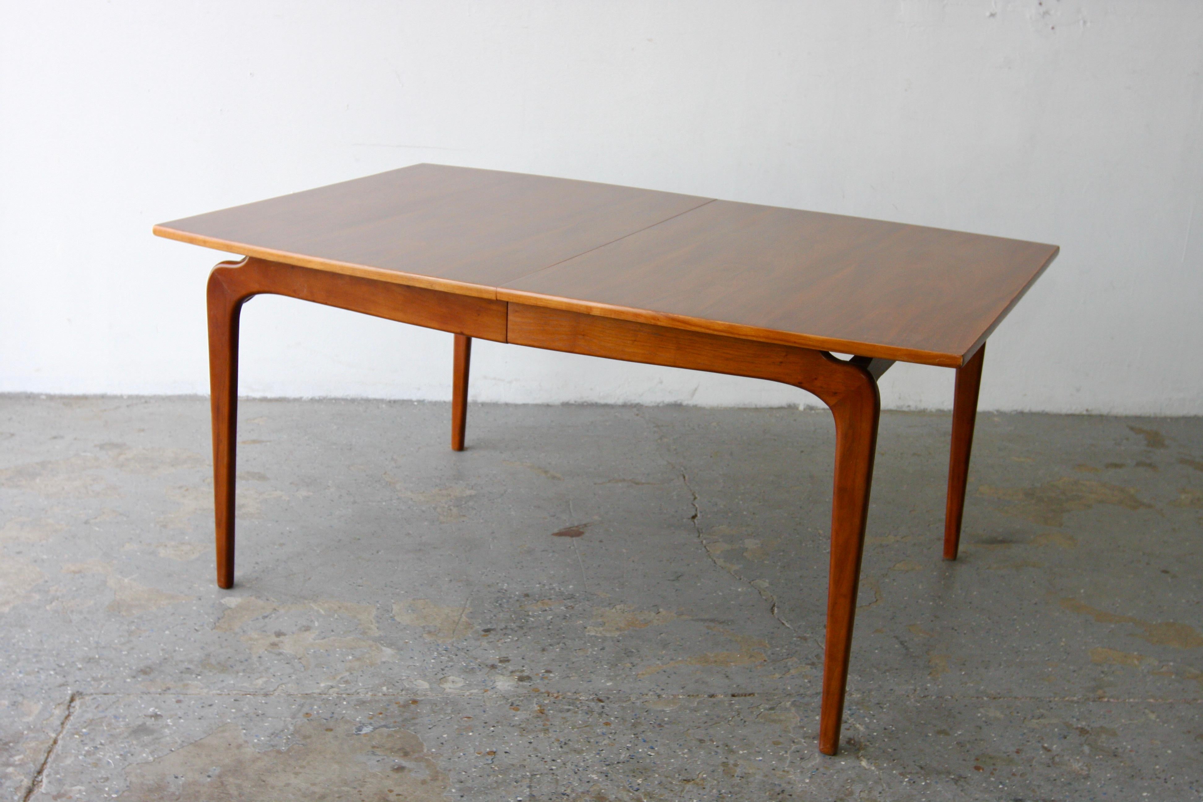 Mid Century Modern Lane Furniture Perception Group extension dining table Walnut  Model: 57. Walnut dining table from the Perception Group by Lane Furniture. Designed by Warren Church. Lower Sculpted legs are made of solid wood.  

61 in Long 42 in