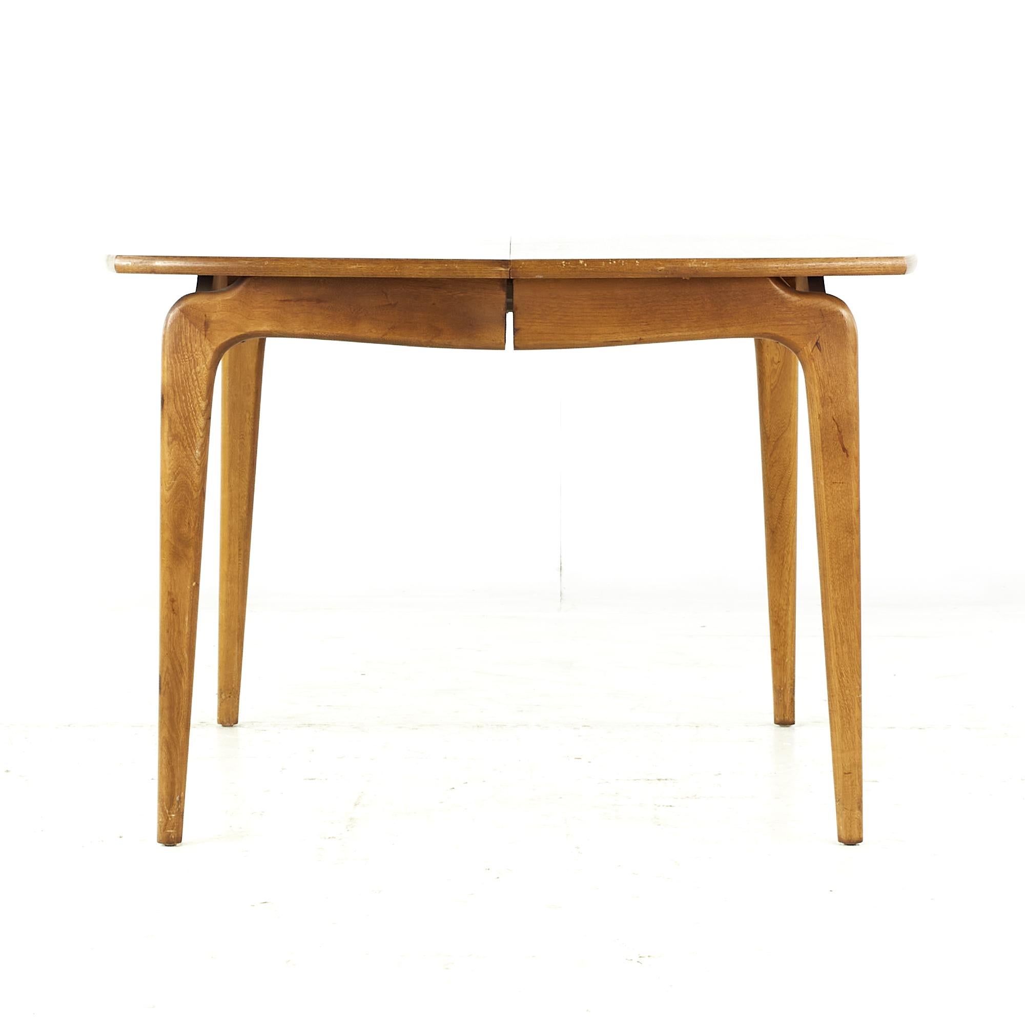 Lane perception midcentury walnut expanding dining table with 2 leaves.

This table measures: 42 wide x 42 deep x 29 high, with a chair clearance of 25.25 inches, each leaf measures 18 inches wide, making a maximum table width of 78 inches when