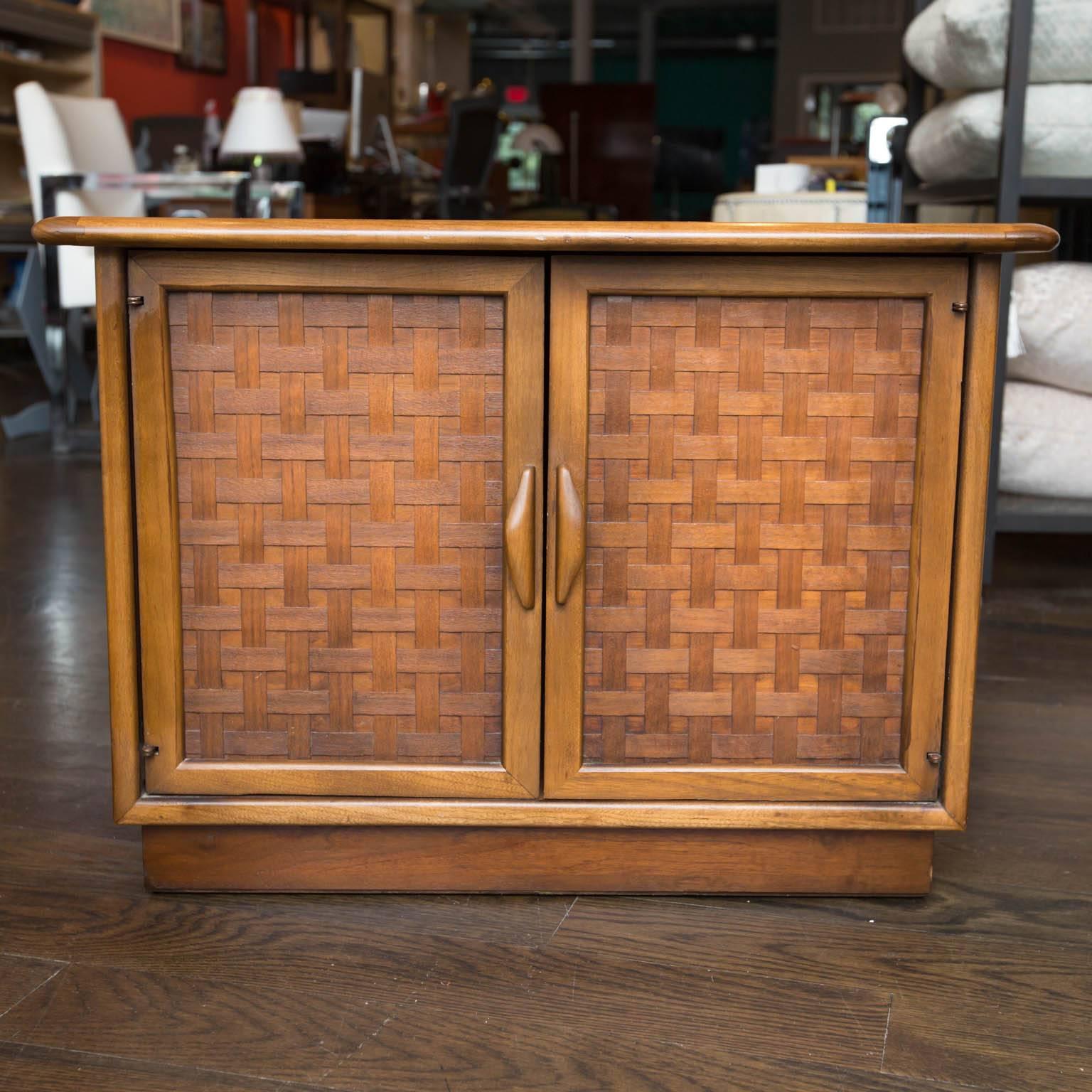 Large side table from the Lane Perception series in walnut. Features two doors with basket weave fronts.