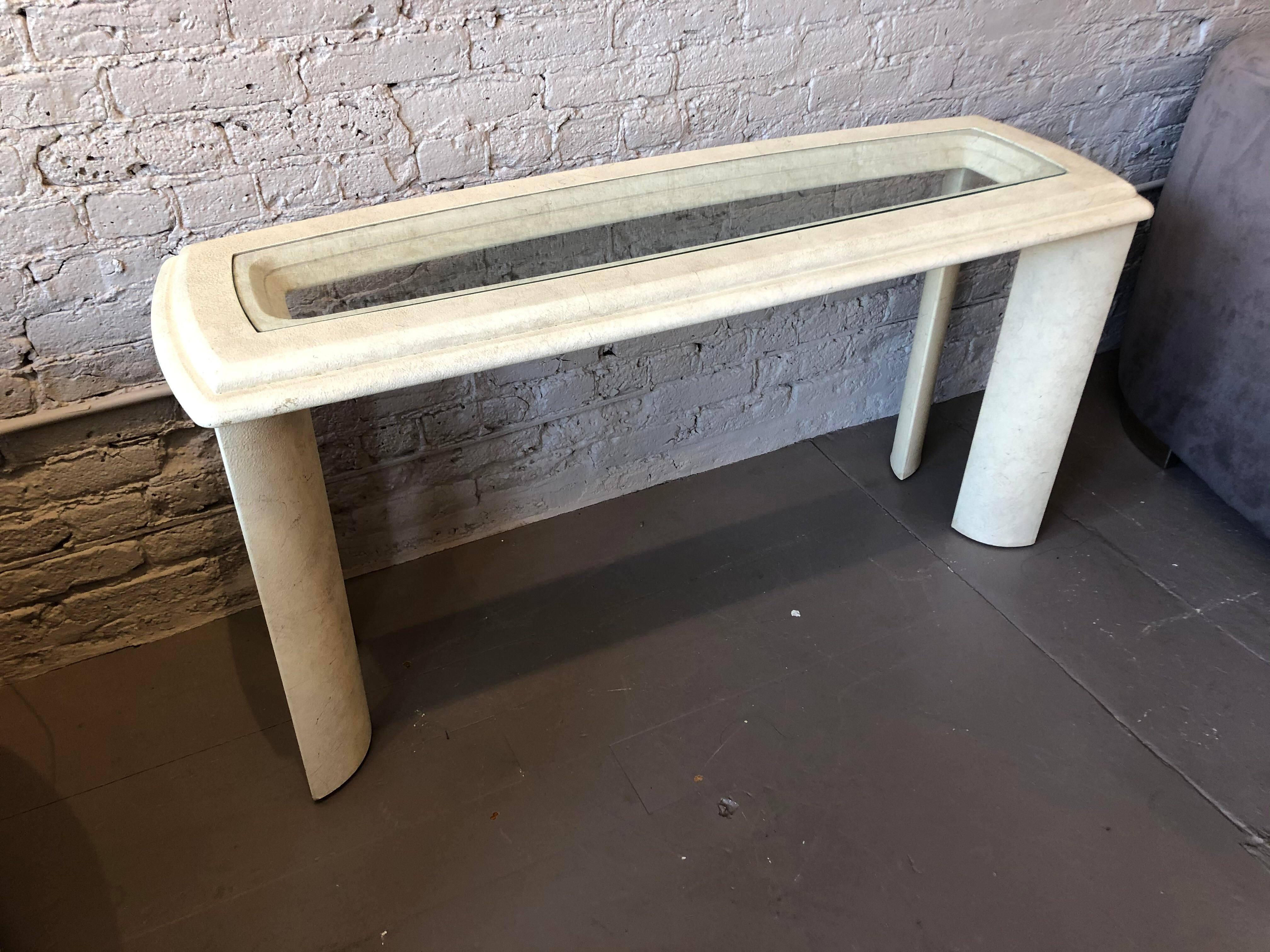 Cool and breezy console table with a glass insert. No chips or cracks and in excellent vintage condition. The interior measurement is 42” (if you want to put a bench/ottoman).

Dimensions: 54