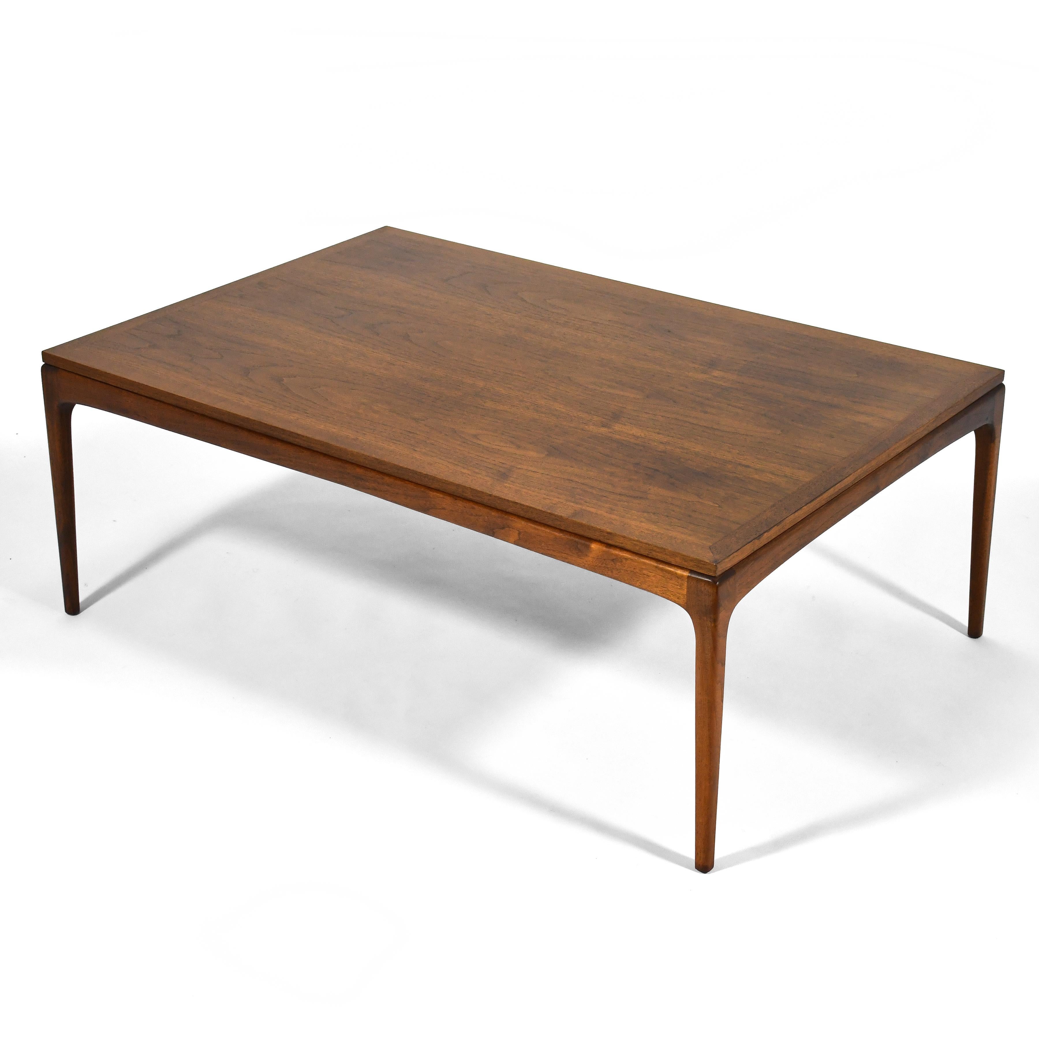 A handsome coffee table in walnut, this design from the Lane 