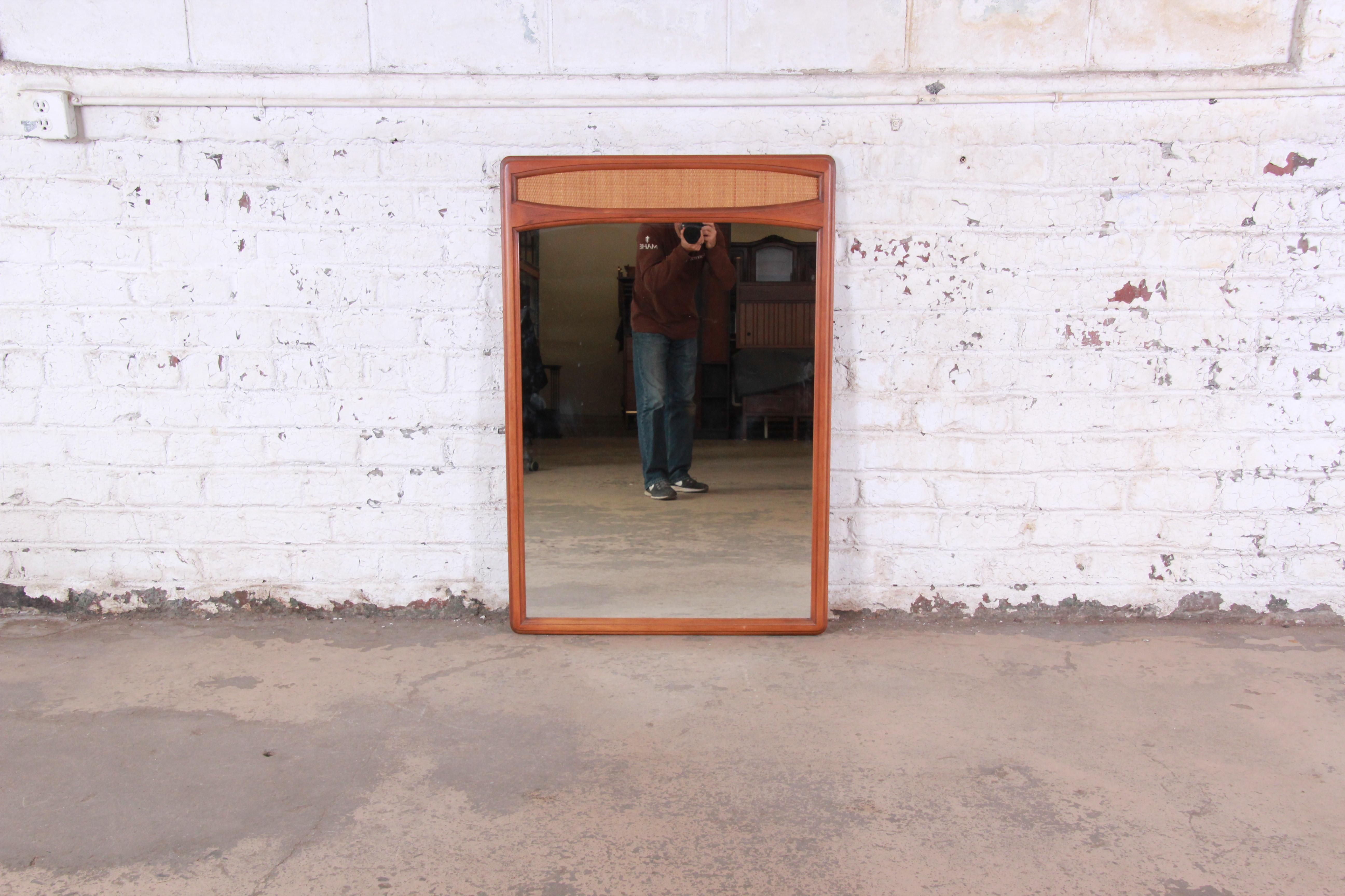Mid-Century Modern cane and walnut framed mirror

Made by Lane Furniture Co. 