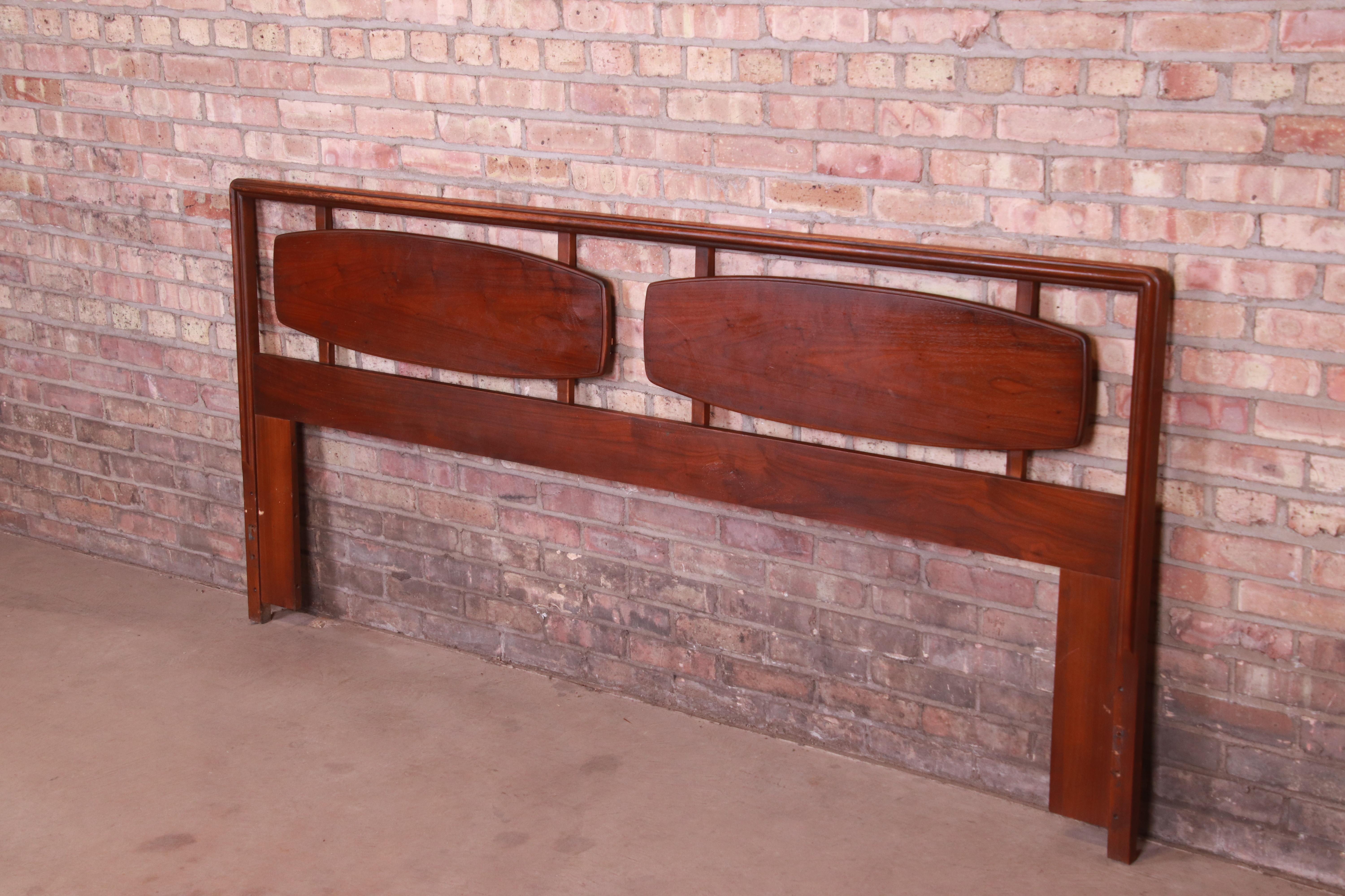 A gorgeous Mid-Century Modern sculpted walnut king size headboard

By Lane Furniture 
