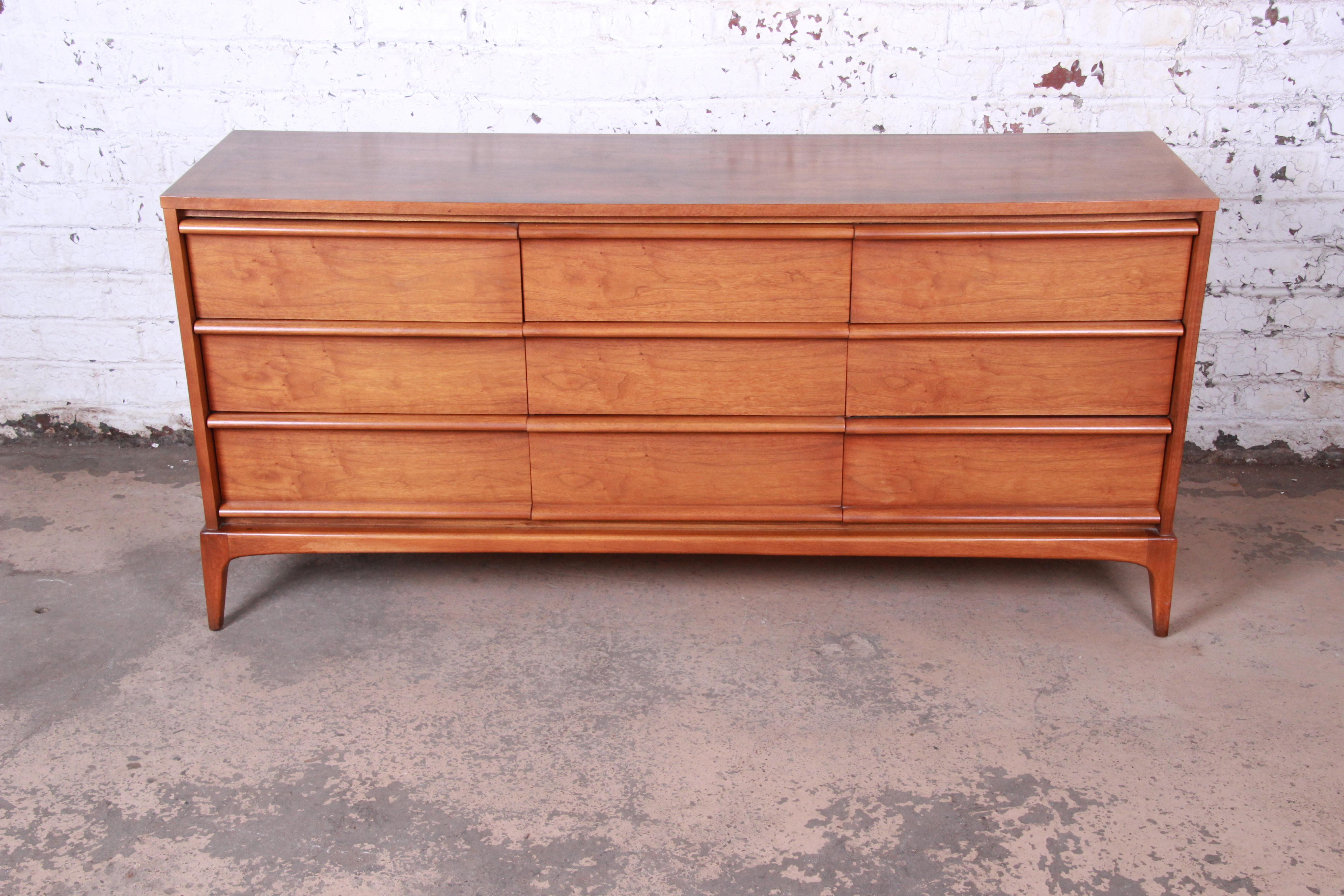A gorgeous Mid-Century Modern walnut long dresser or credenza from the 