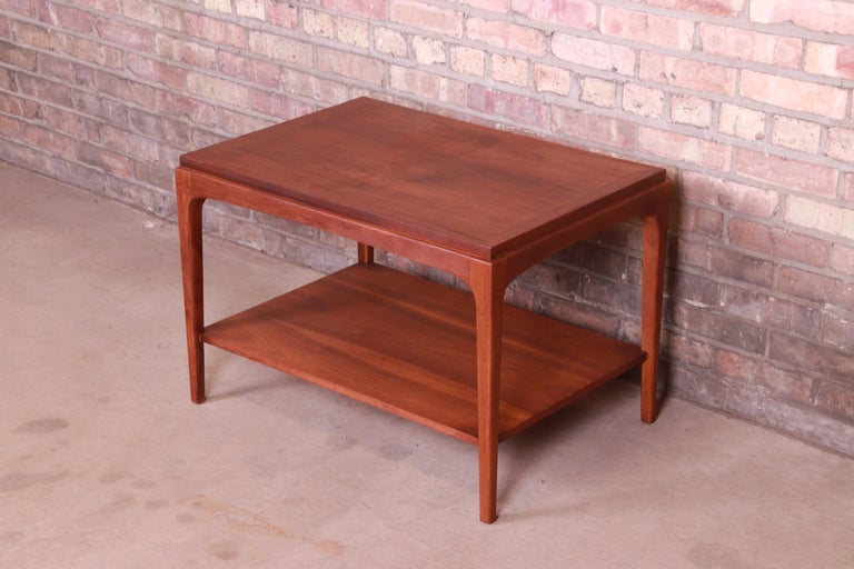 A gorgeous Mid-Century Modern sculpted walnut two-tier occasional side table

By Lane Furniture 