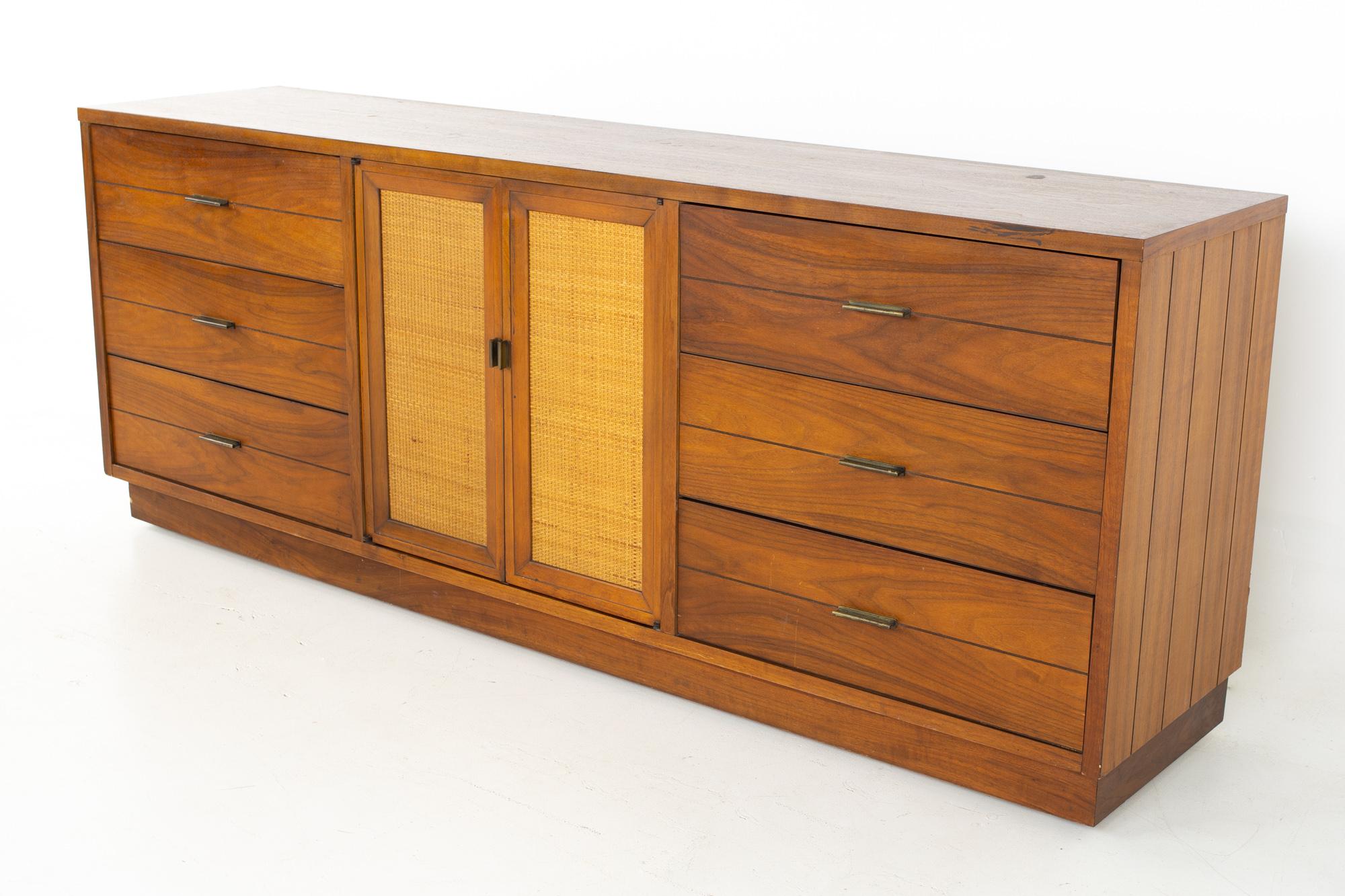 Lane Rhythm Mid Century walnut and cane 9 drawer lowboy dresser
Dresser measures: 78 wide x 18 deep x 30.75 inches high

All pieces of furniture can be had in what we call restored vintage condition. That means the piece is restored upon purchase