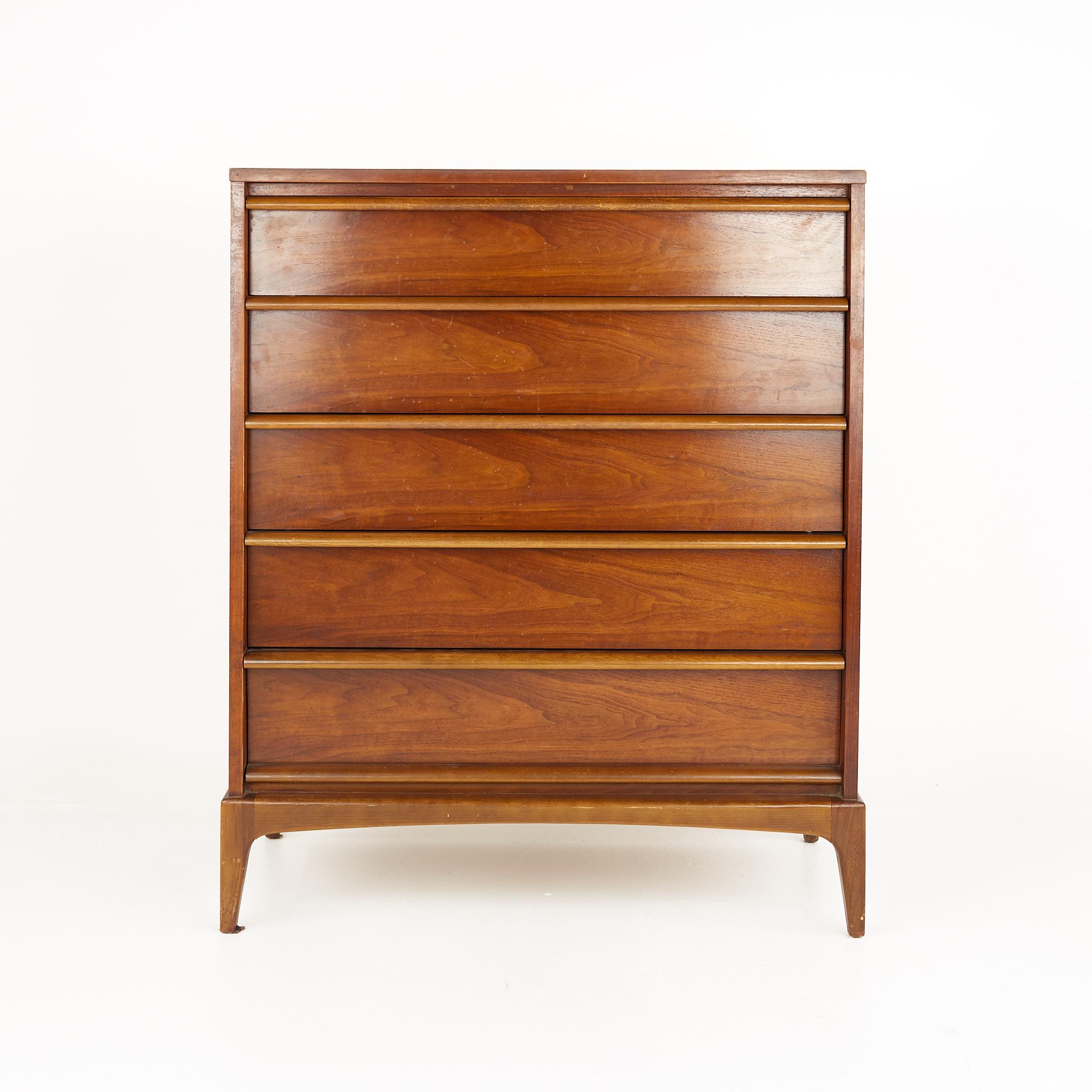 Lane Rhythm mid century walnut highboy dresser

This dresser measures: 36 wide x 18 deep x 44 inches high

?All pieces of furniture can be had in what we call restored vintage condition. That means the piece is restored upon purchase so it’s