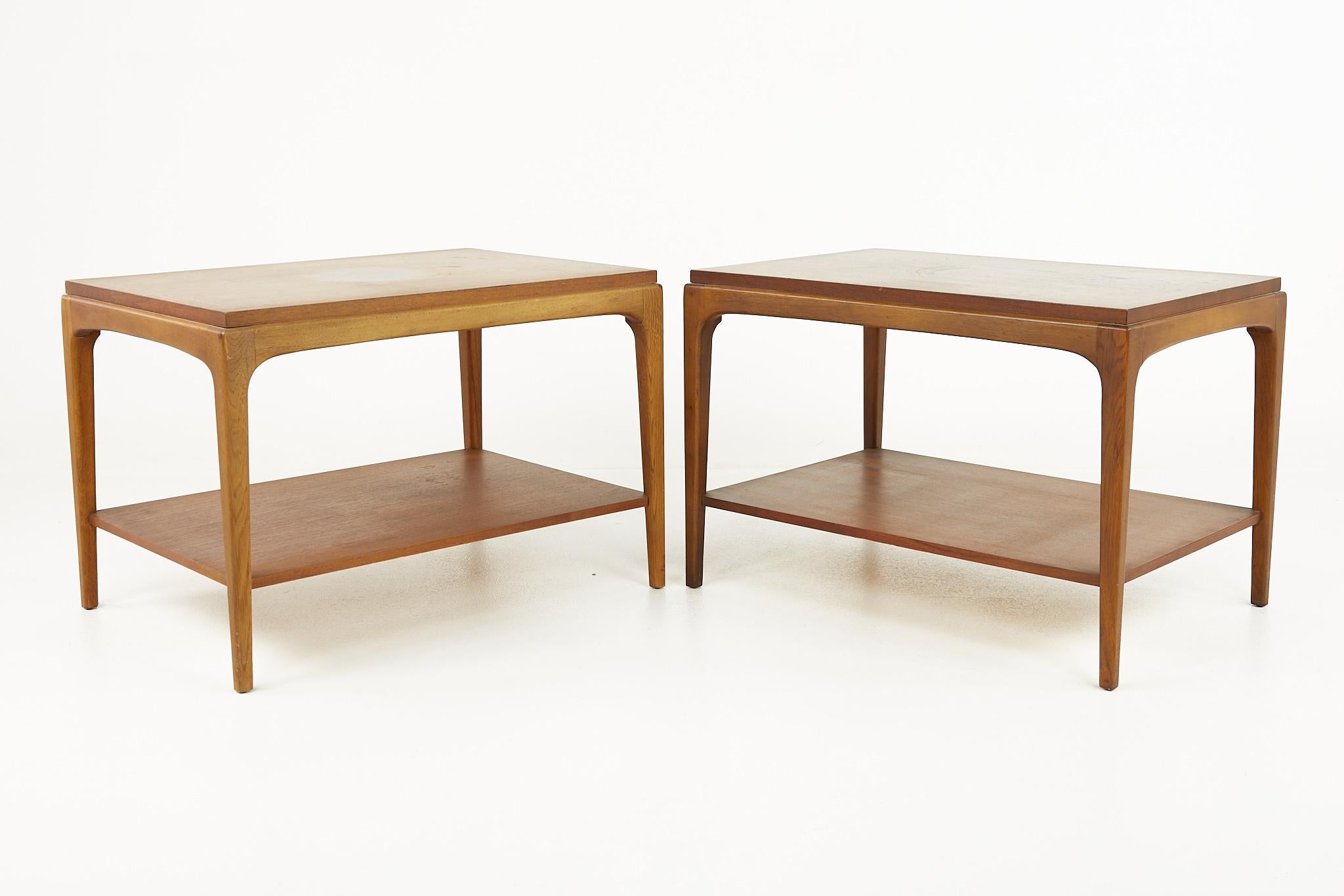 Lane rhythm mid century walnut side end tables - pair

Each table measures: 30 wide x 21 deep x 20.5 inches high

All pieces of furniture can be had in what we call restored vintage condition. That means the piece is restored upon purchase so